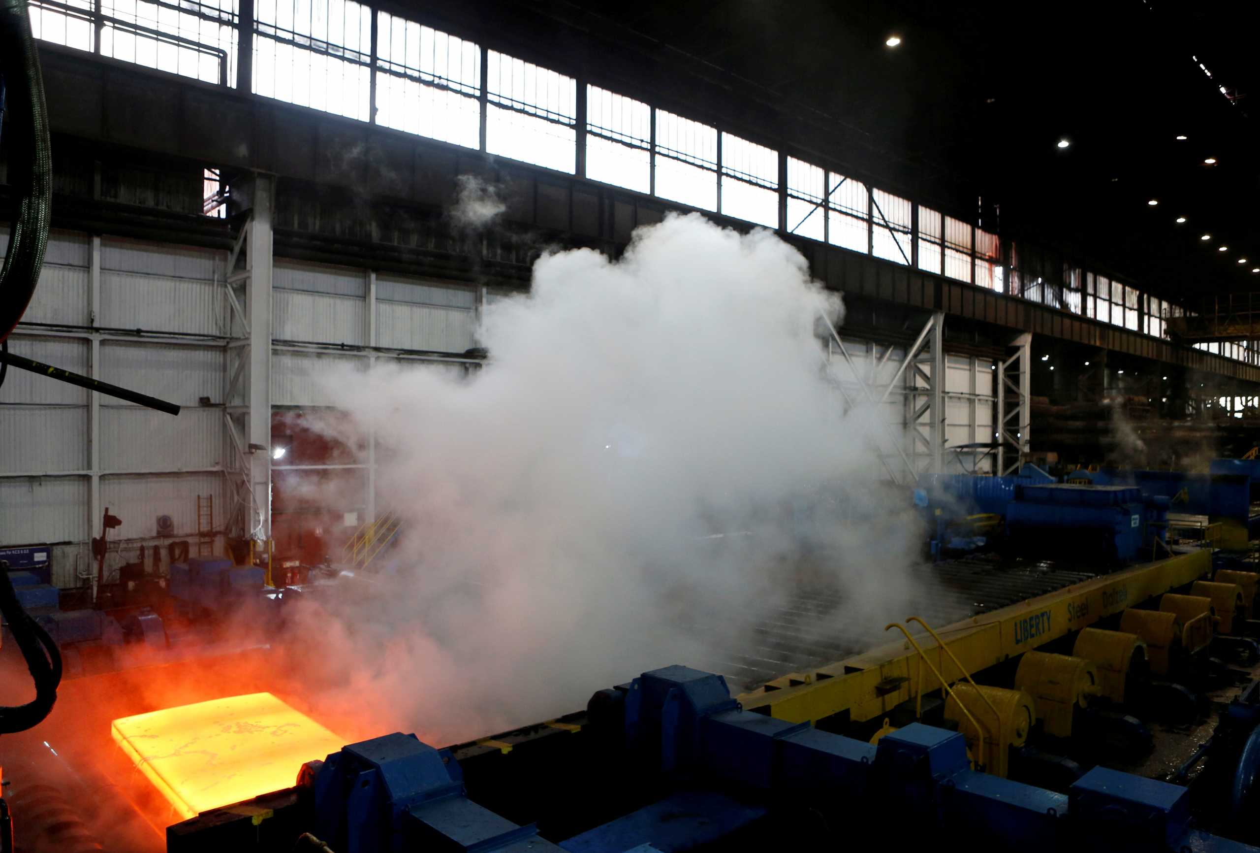 FILE PHOTO: Steel is seen in the rolling mill following the  recommissioning of the works by Liberty Steel Group at the Dalzell steel plant in Motherwell, Britain September 28, 2016. REUTERS