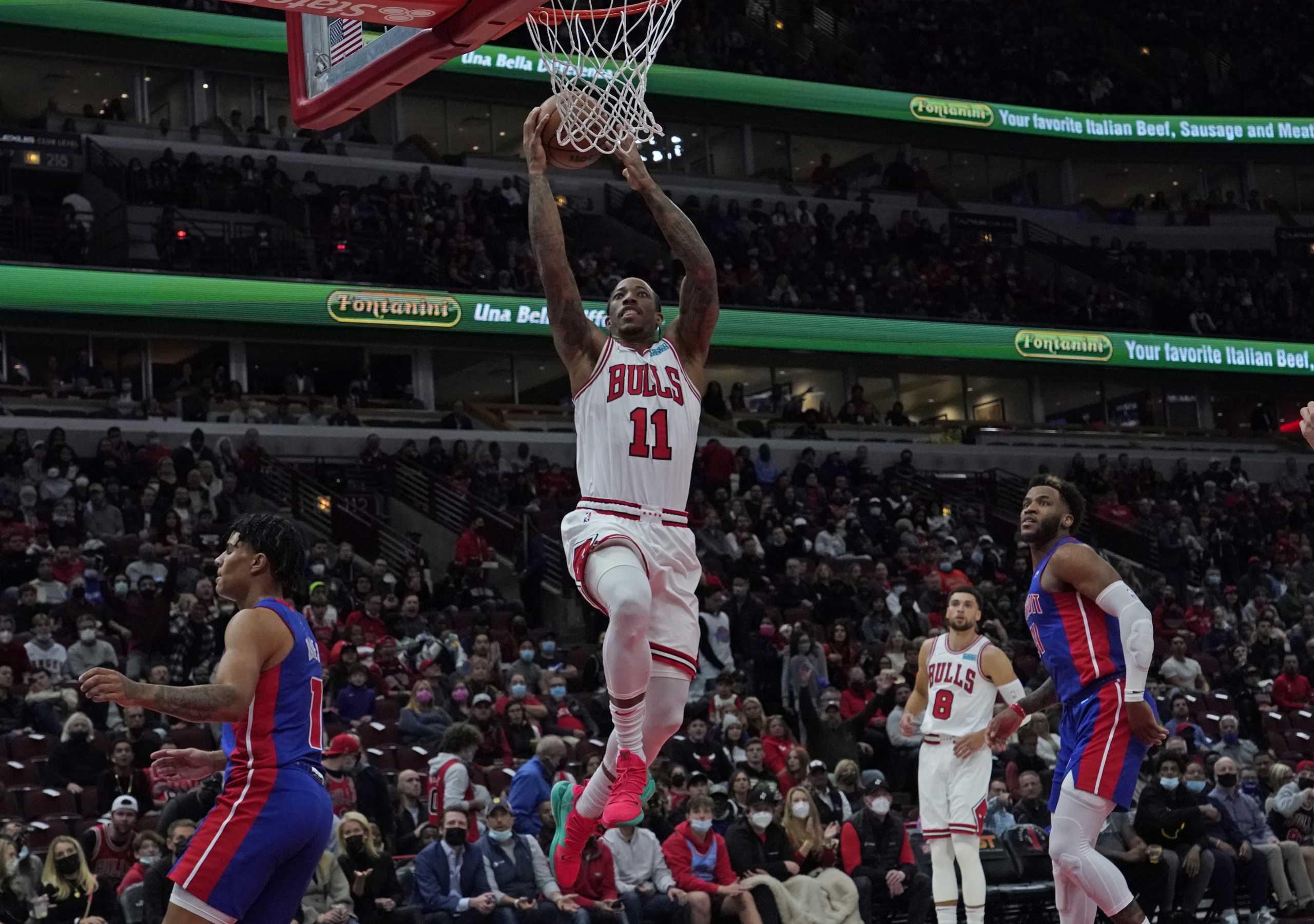 Oct 23, 2021; Chicago, Illinois, USA; Chicago Bulls forward DeMar DeRozan (11) scores against the Detroit Pistons during the first half at United Center. Mandatory Credit: David Banks-USA TODAY Sports