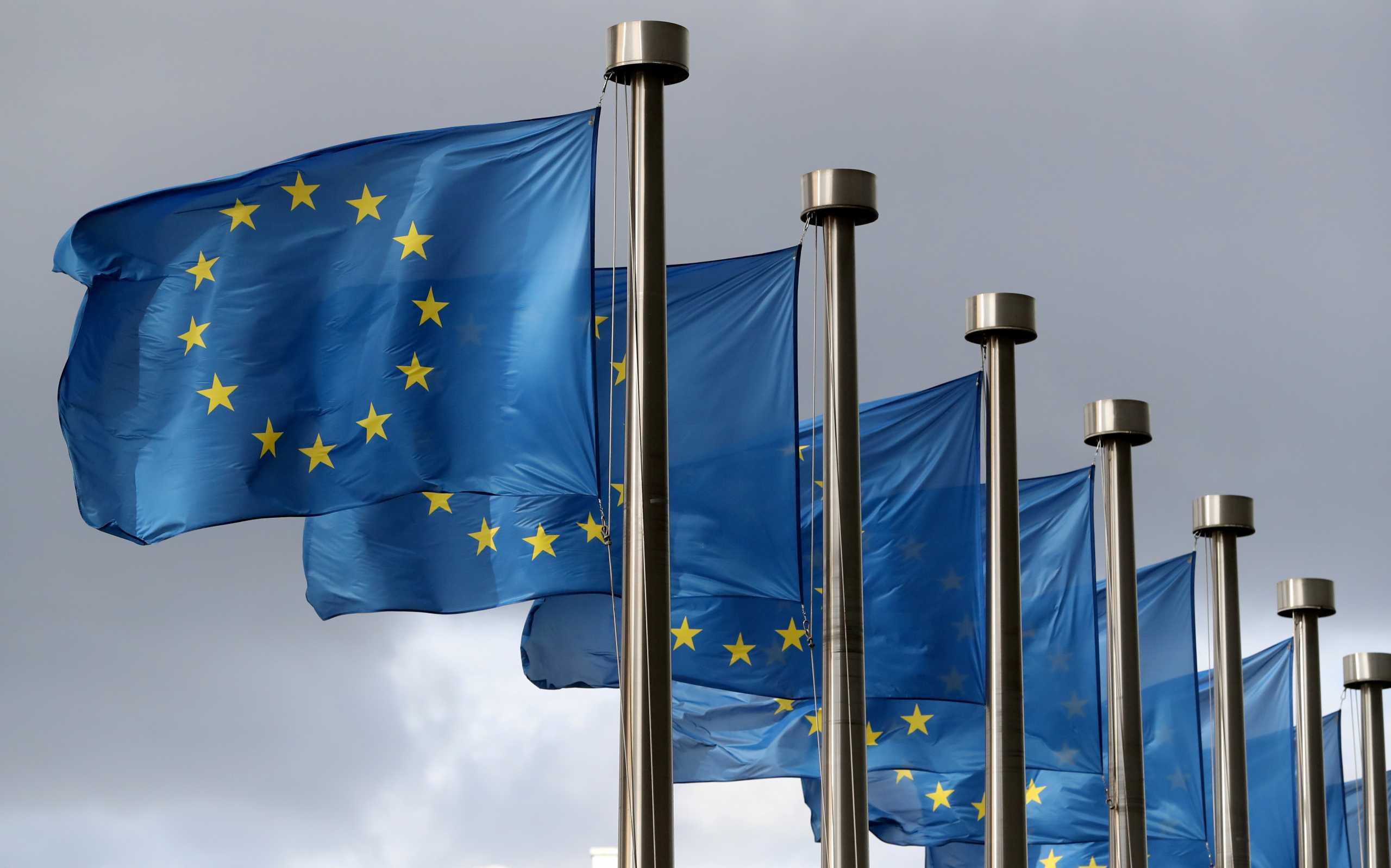 FILE PHOTO: EU flags flutter in front of the European Commission headquarters in Brussels, Belgium October 2, 2019. REUTERS