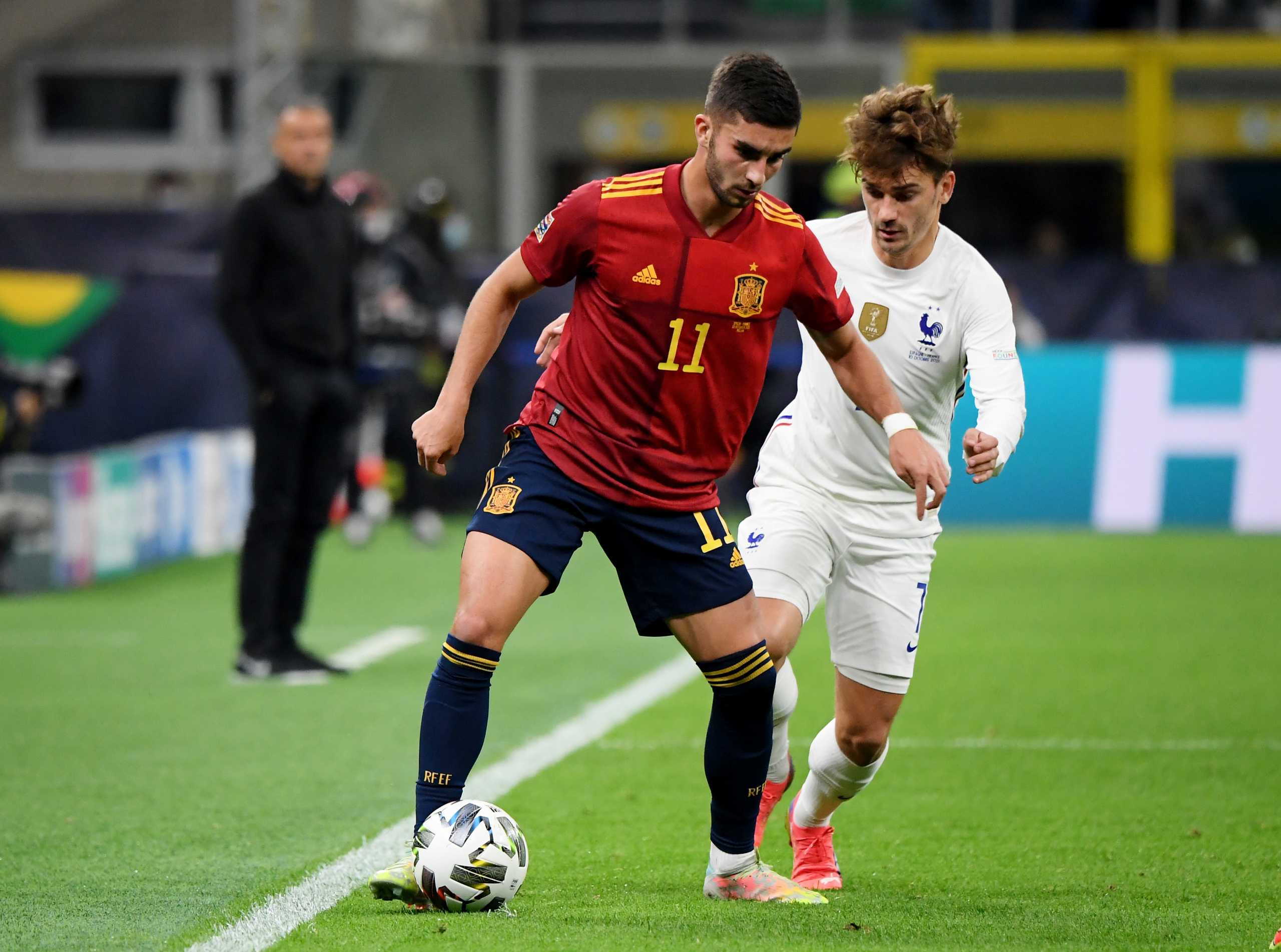 Soccer Football - Nations League - Final - Spain v France - San Siro, Milan, Italy - October 10, 2021 Spain's Ferran Torres in action with France's Antoine Griezmann REUTERS