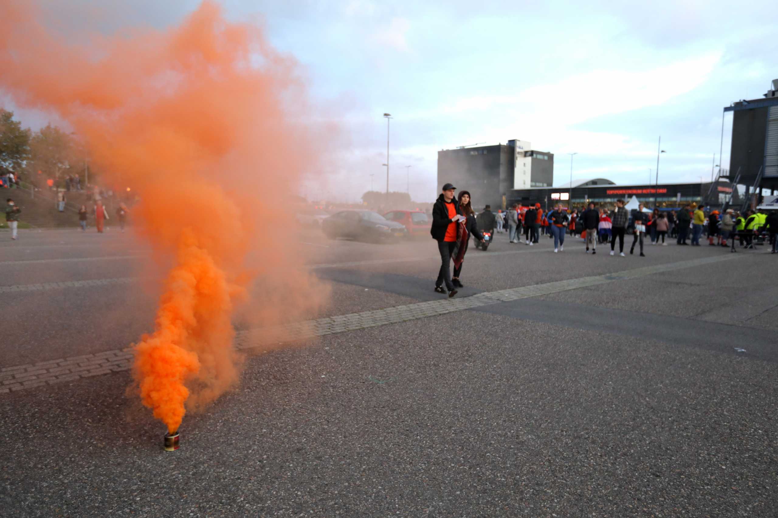 Soccer Football - World Cup - UEFA Qualifiers - Group G - Netherlands v Gibraltar - Feyenoord Stadium, Rotterdam, Netherlands - October 11, 2021 A flare is seen outside the stadium before the match REUTERS