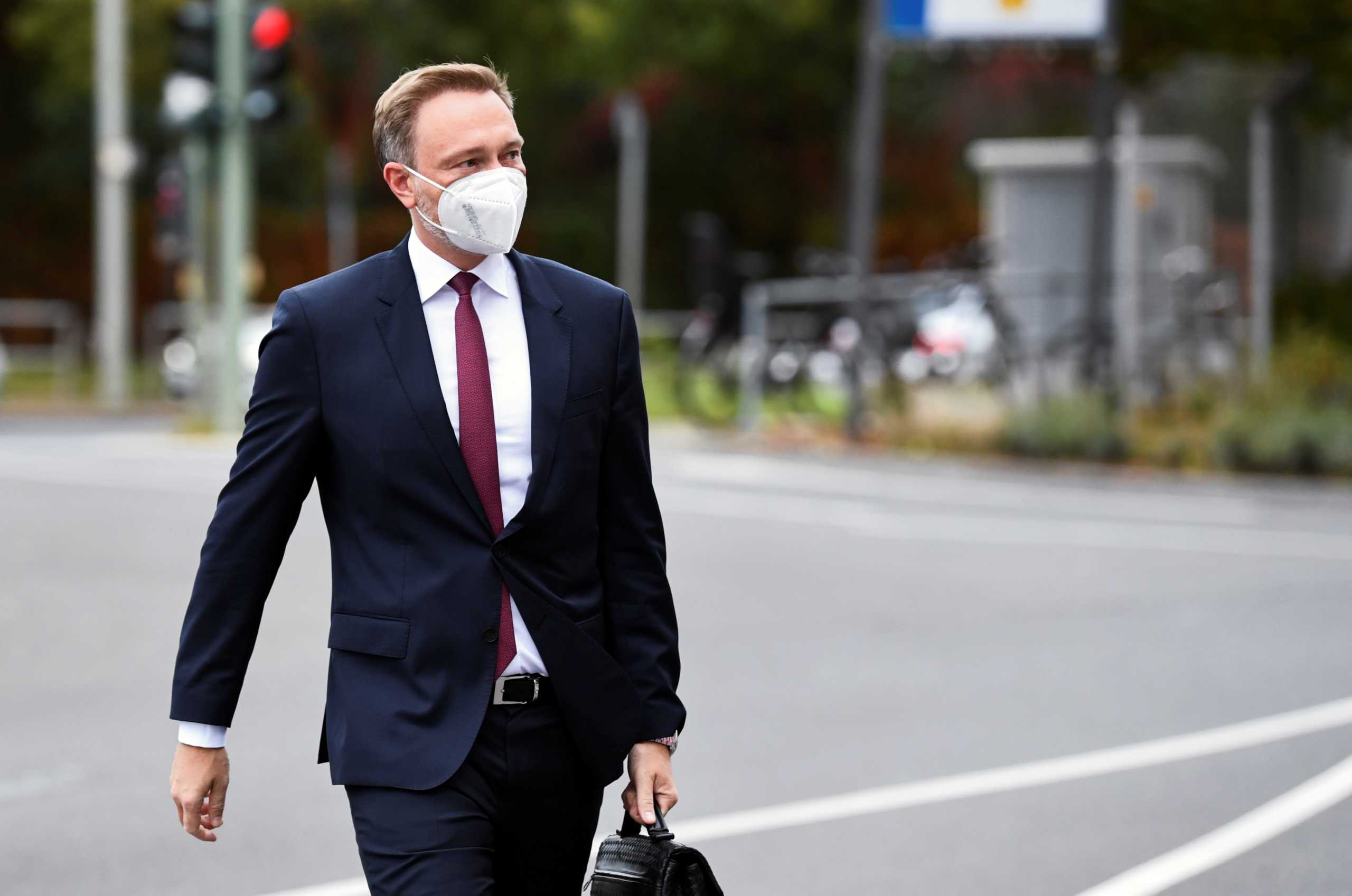 Free Democratic Party (FDP) leader Christian Lindner arrives at a meeting for exploratory talks for a possible new government coalition in Berlin, Germany, October 15, 2021. REUTERS