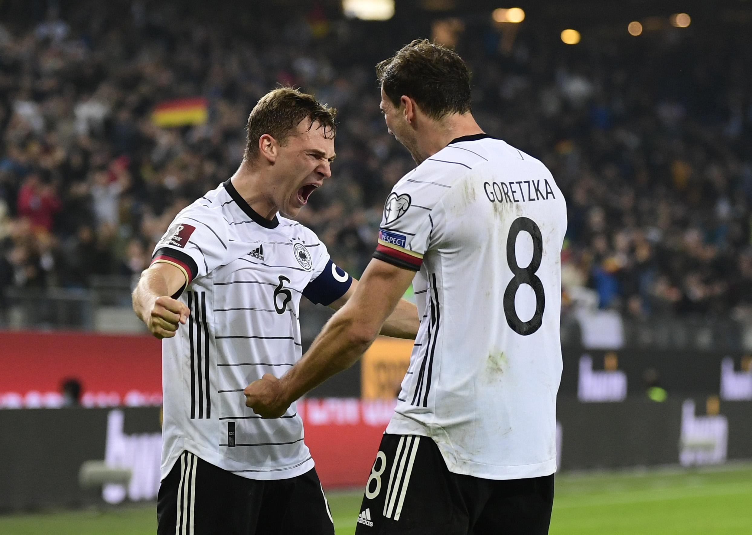 Soccer Football - World Cup - UEFA Qualifiers - Group J - Germany v Romania - Volksparkstadion, Hamburg, Germany - October 8, 2021 Germany's Joshua Kimmich celebrates with Leon Goretzka after Thomas Muller scores their second goal REUTERS
