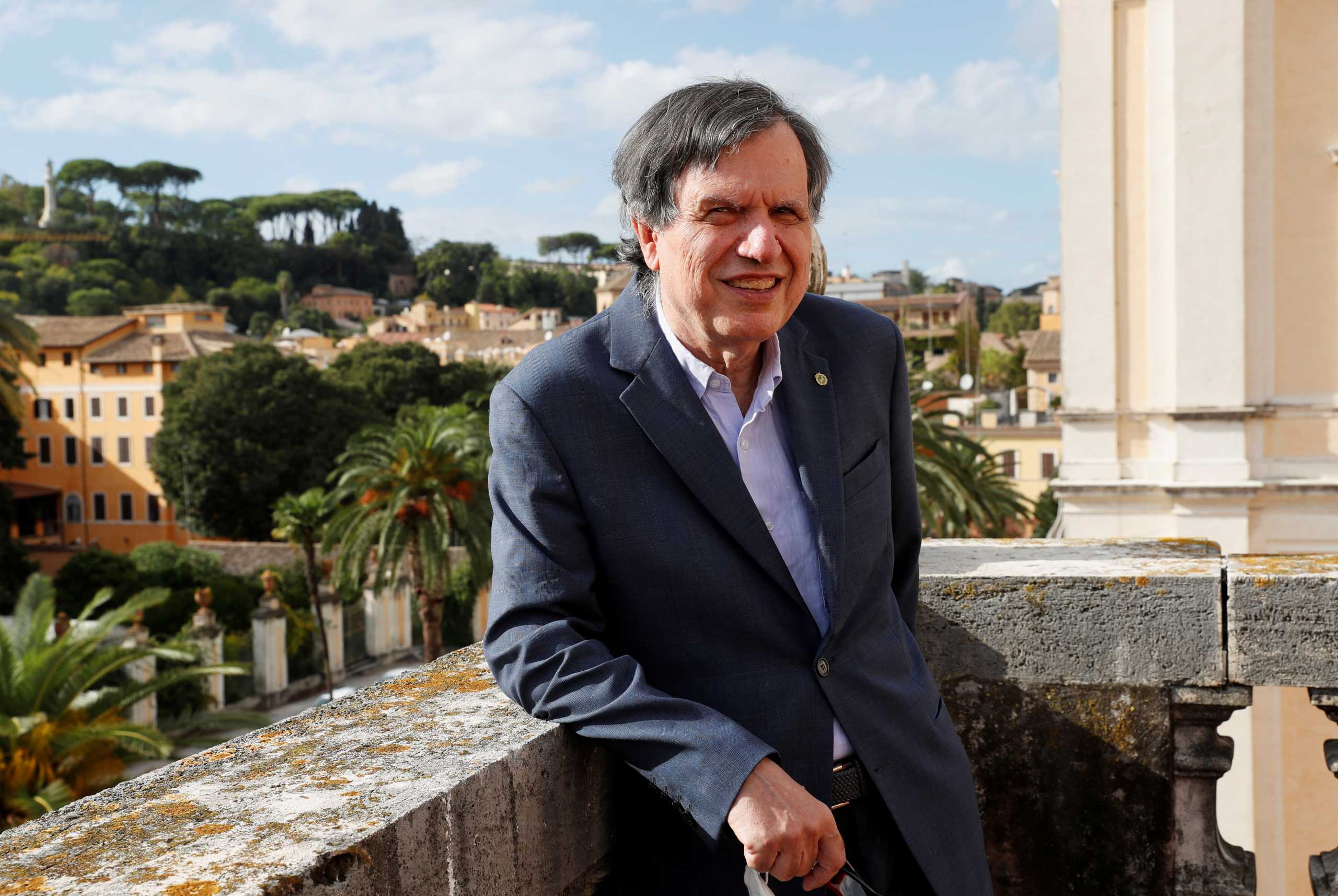 Joint winner of the Nobel Prize for Physics, Italian scientist Giorgio Parisi, poses for pictures after the announcement in Rome, Italy, October 5, 2021. REUTERS