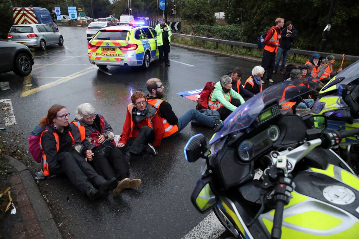 Insulate Britain activists block a motorway junction near Heathrow Airport, in London, Britain, October 1, 2021. REUTERS