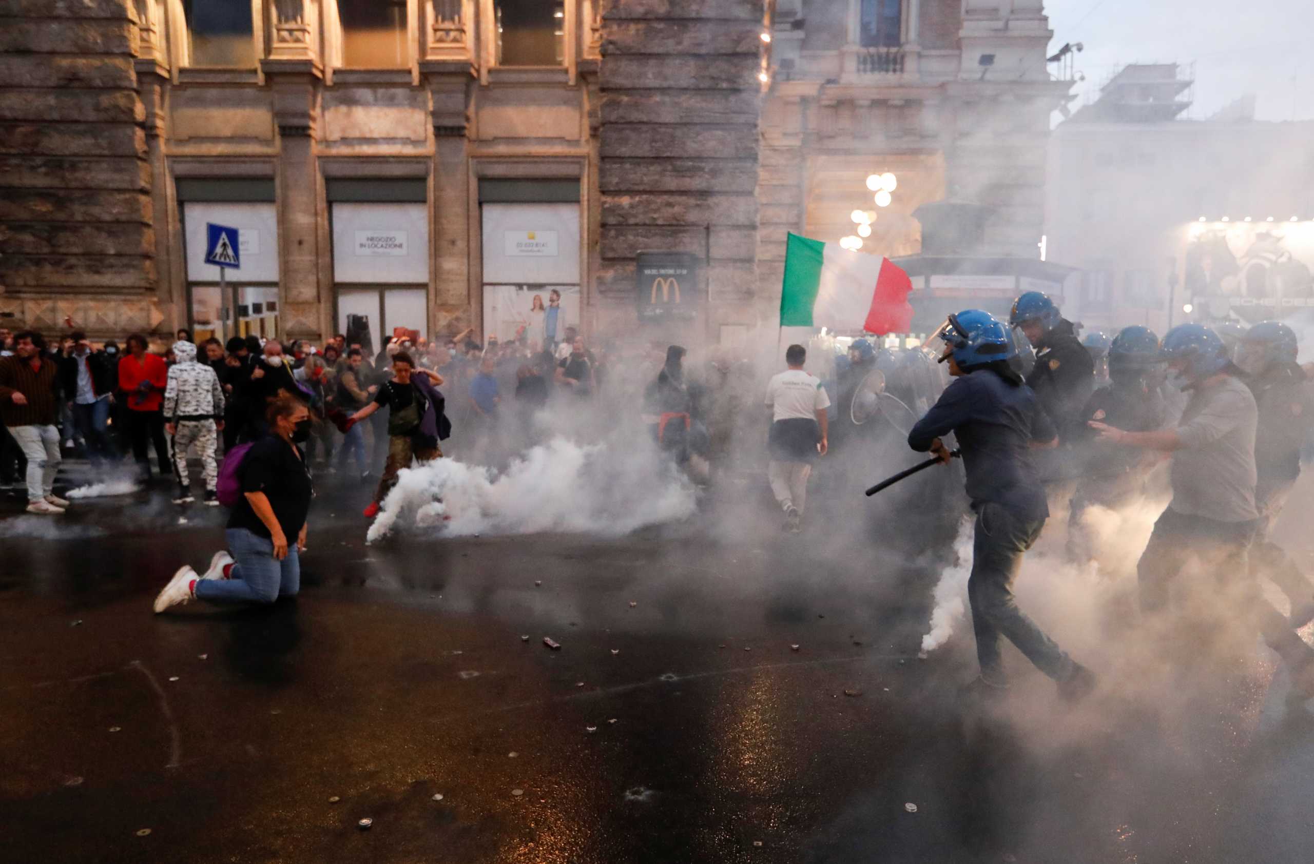 Demonstrators clash with police officers during a protest against the government's introduction of the "Green Pass" near Chigi Palace in Rome, Italy, October 9, 2021. REUTERS