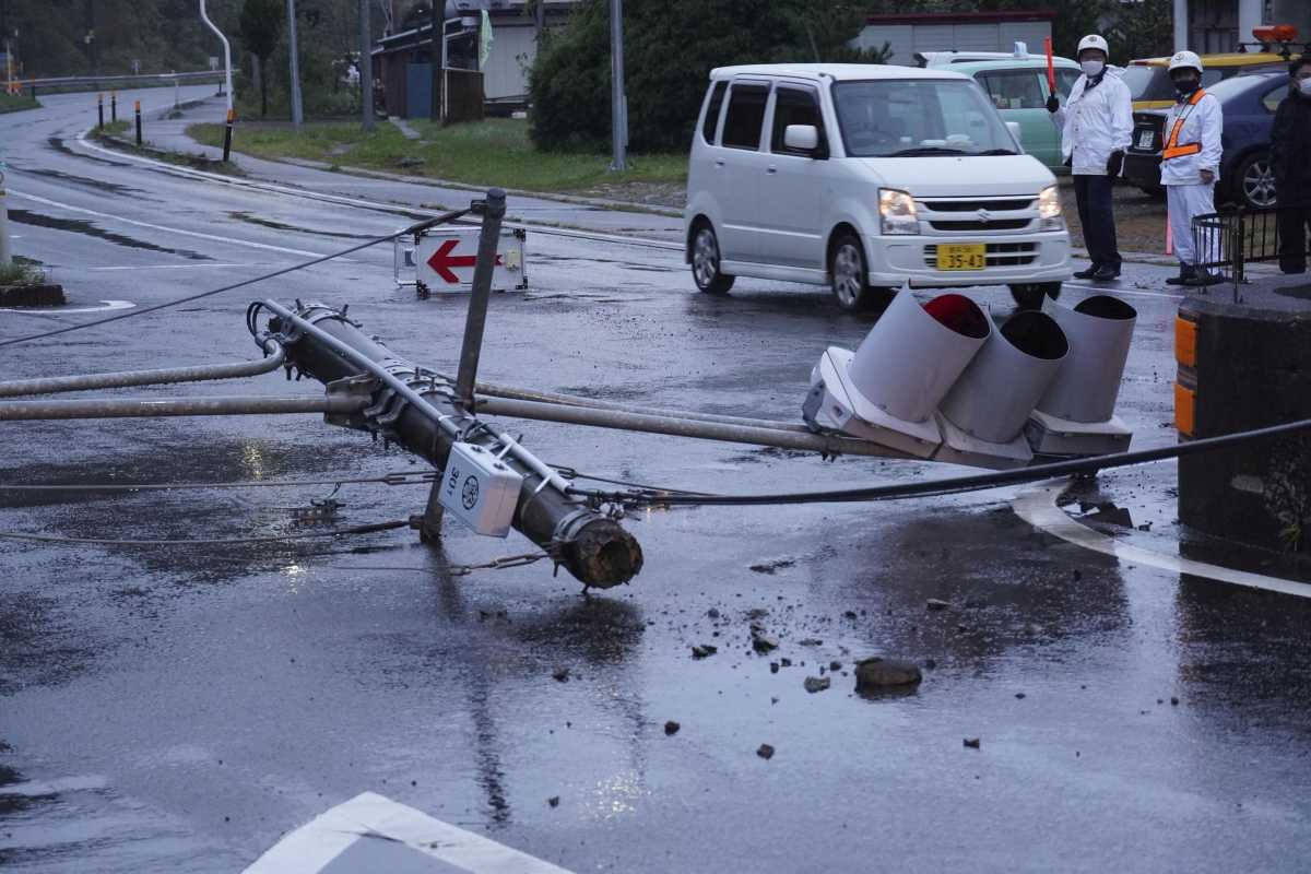 Damaged traffic lights are seen on the road after an earthquake hit Iwate town, Iwate Prefecture, Japan in this photo taken by Kyodo October 6, 2021. Mandatory credit Kyodo