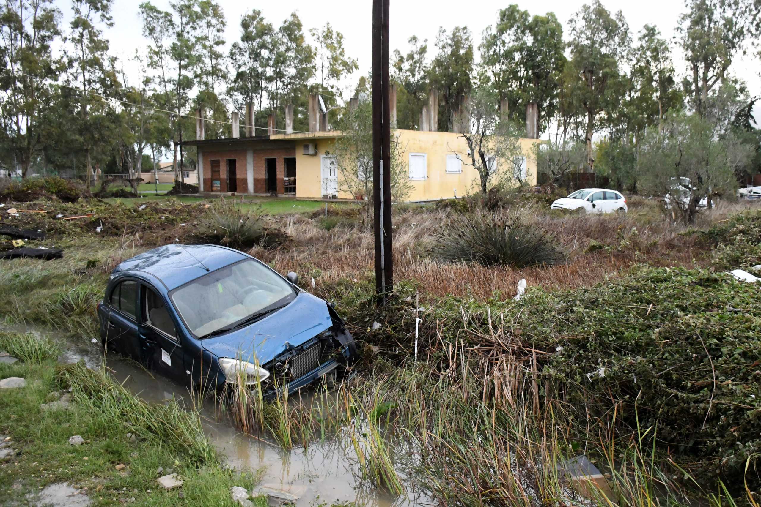 A damaged car is seen on a field, following heavy rainfall in the village of Moraitika on the island of Corfu, Greece, October 15, 2021. REUTERS