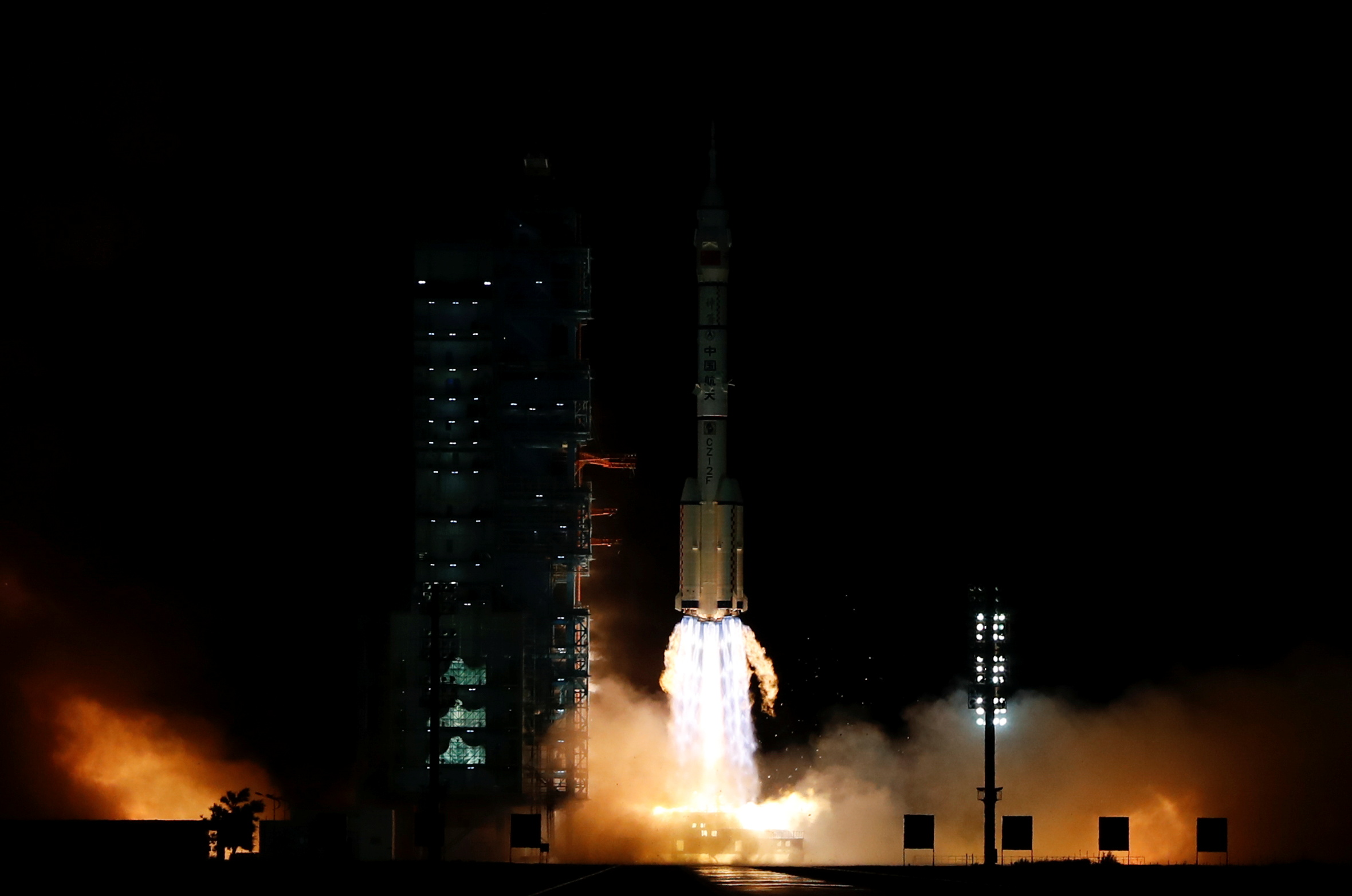 The Long March-2F Y13 rocket, carrying the Shenzhou-13 spacecraft and three astronauts in China's second crewed mission to build its own space station, launches at Jiuquan Satellite Launch Center near Jiuquan, Gansu province, China October 16, 2021. REUTERS