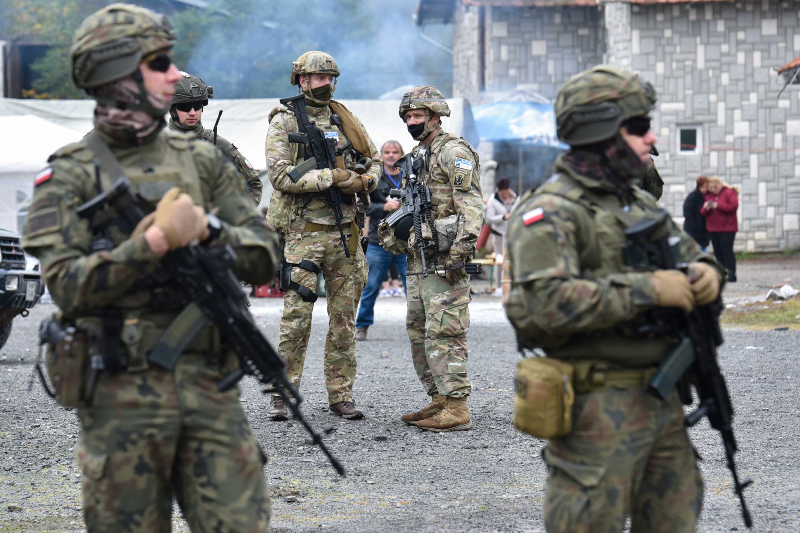 Members of the KFOR peacekeeping force patrol the area near the border crossing between Kosovo and Serbia in Jarinje, Kosovo, October 2, 2021. REUTERS