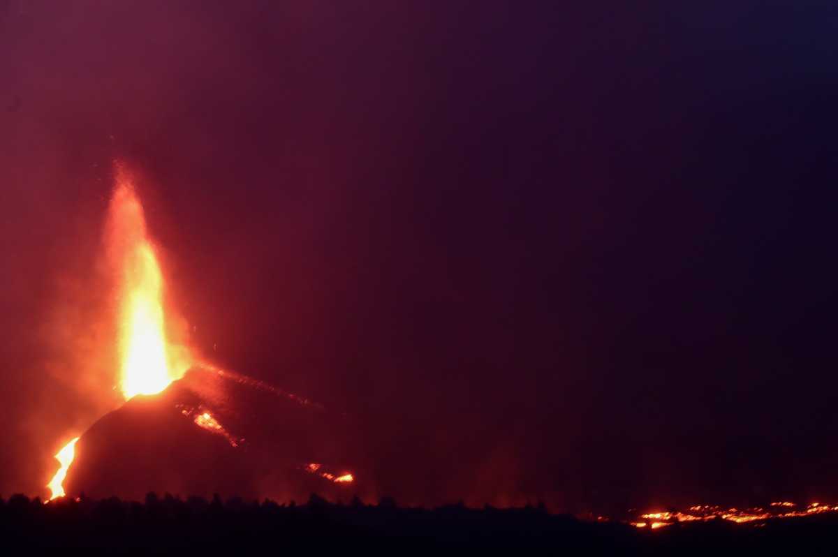 Lava rolls down as the Cumbre Vieja volcano continues to erupt on the Canary Island of La Palma, as seen from Tajuya, Spain, October 11, 2021. REUTERS