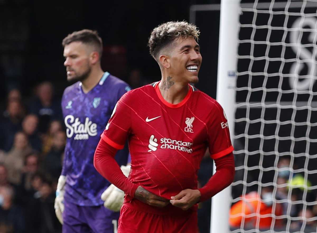 Soccer Football - Premier League - Watford v Liverpool - Vicarage Road, Watford, Britain - October 16, 2021 Liverpool's Roberto Firmino celebrates scoring their fifth goal as Watford's Ben Foster looks dejected Action Images via Reuters