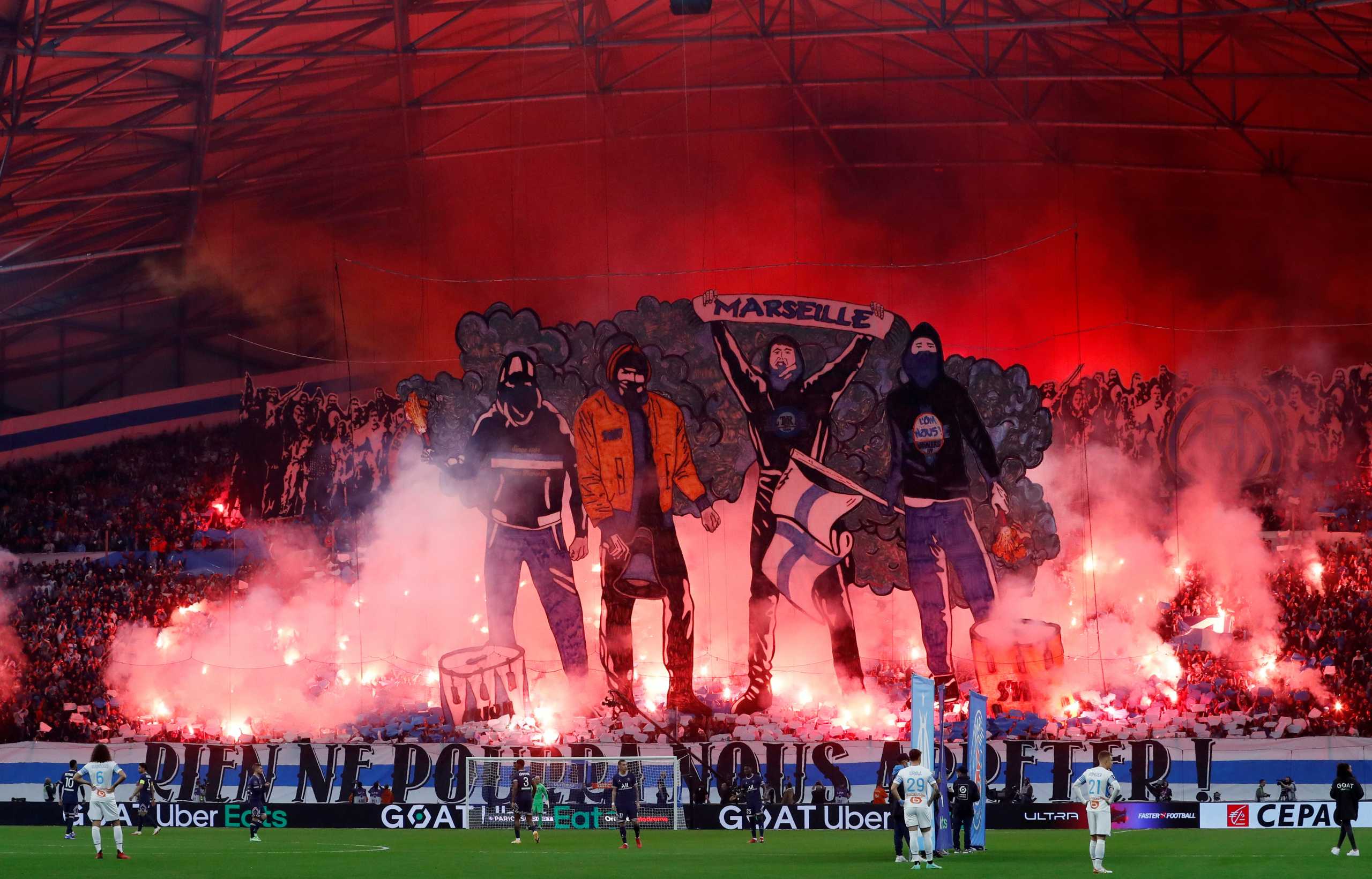 Soccer Football - Ligue 1 - Olympique de Marseille v Paris St Germain - Orange Velodrome, Marseille, France - October 24, 2021 Olympique de Marseille fans with flares before the match REUTERS
