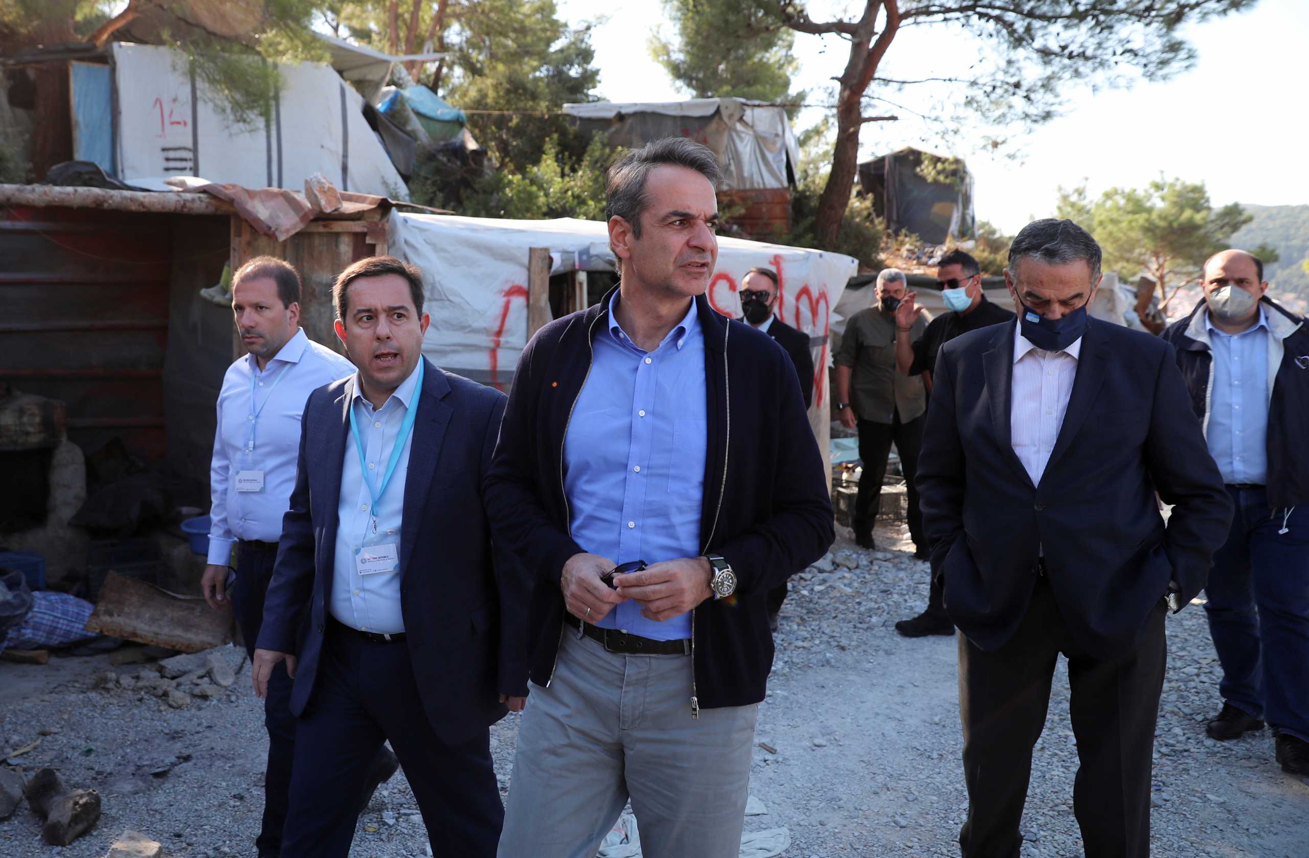 Greek Prime Minister Kyriakos Mitsotakis and Migration Minister Notis Mitarachi visit a disused migrant camp on the island of Samos, Greece, October 1, 2021. REUTERS