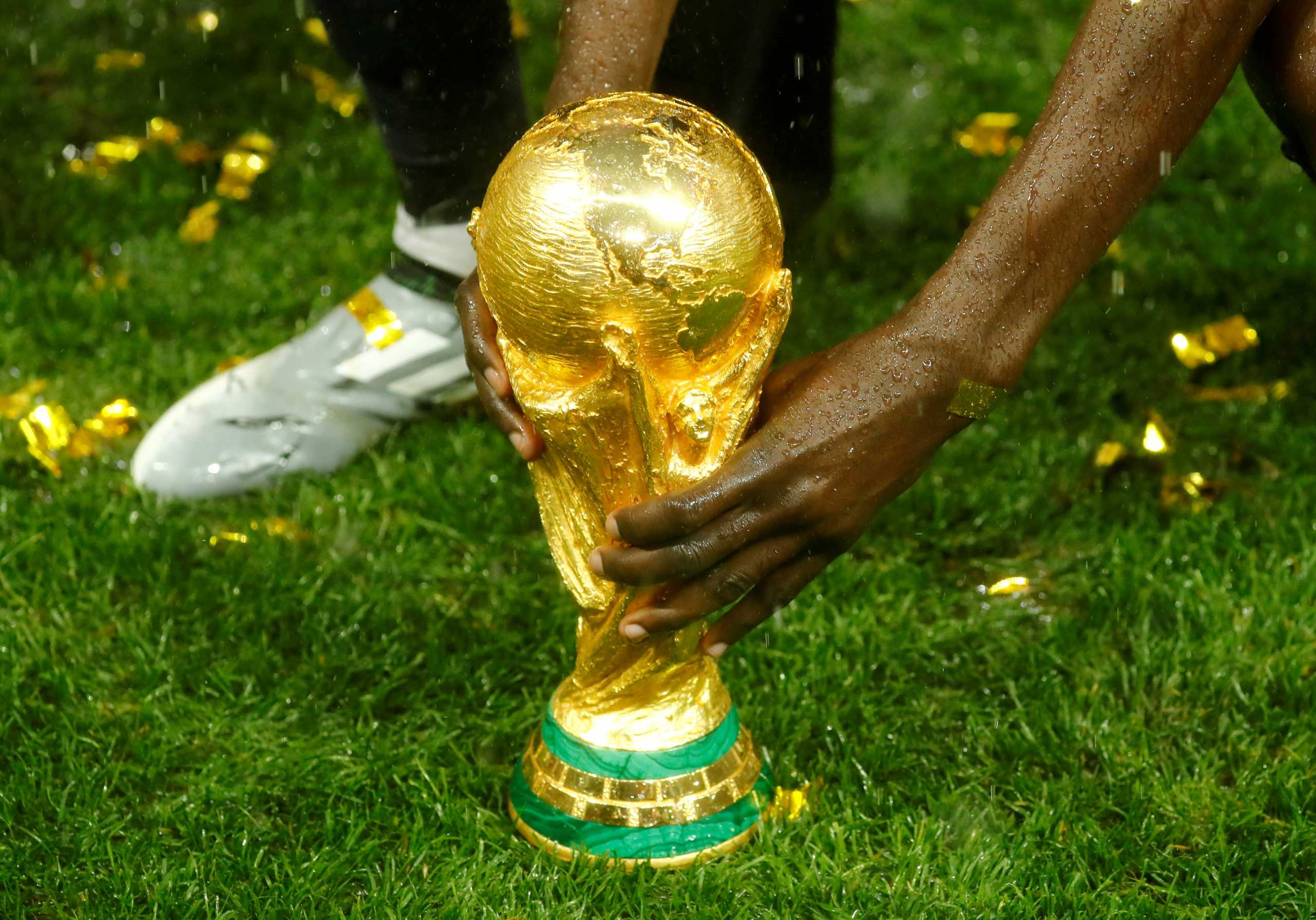 FILE PHOTO: Soccer Football - World Cup - Final - France v Croatia - Luzhniki Stadium, Moscow, Russia - July 15, 2018  General view of the trophy as France celebrate after winning the World Cup  REUTERS