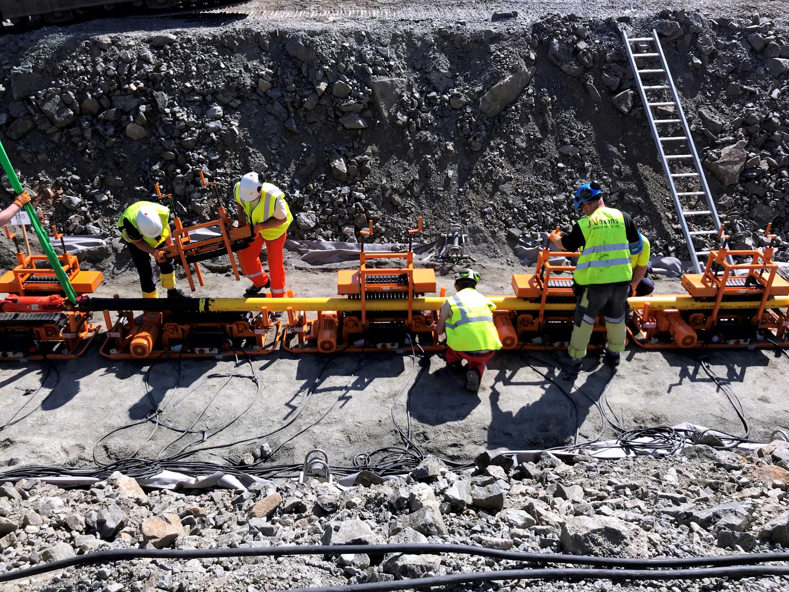 FILE PHOTO: Workers lay a NordLink subsea interconnector power cable to connect Norway and Germany at the Vollesfjord fjord near Flekkefjord, Norway May 31, 2018. REUTERS