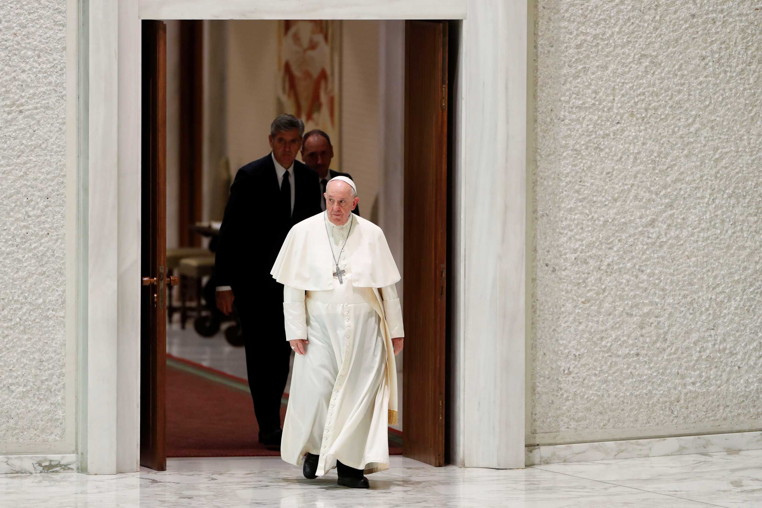 Pope Francis arrives at the Paul VI Hall for the weekly general audience at the Vatican, October 6, 2021. REUTERS