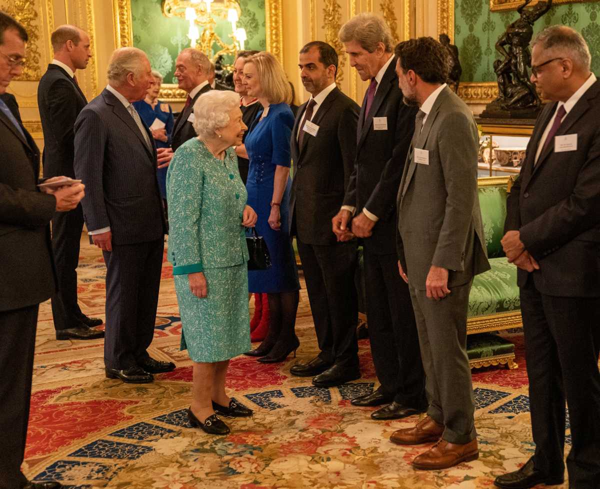 FILE PHOTO: Britain's Queen Elizabeth greets U.S. climate adviser John Kerry at a reception for the Global Investment Summit in Windsor Castle, Windsor, Britain, October 19, 2021. Arthur Edwards