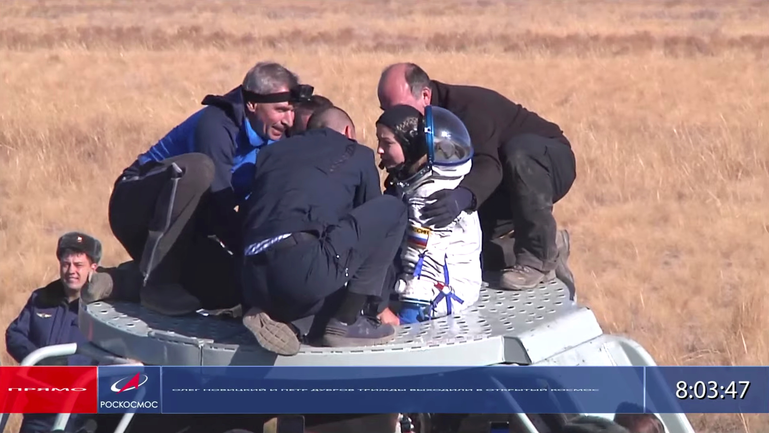 The International Space Station (ISS) crew member Russian actress Yulia Peresild is assisted by ground personnel shortly after landing in a remote area outside Zhezkazgan, Kazakhstan October 17, 2021, in this still image taken from video. Roscosmos