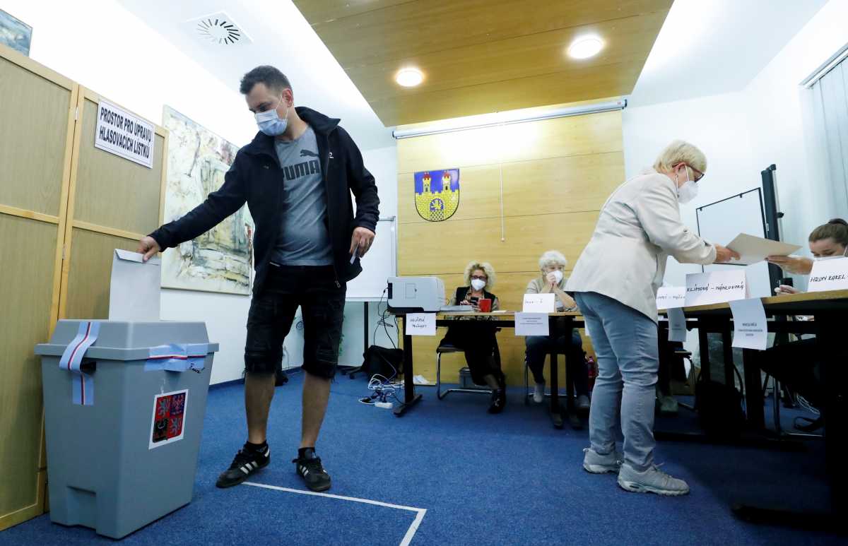 People cast their ballots during the parliamentary elections in Lovosice, Czech Republic, October 8, 2021. REUTERS