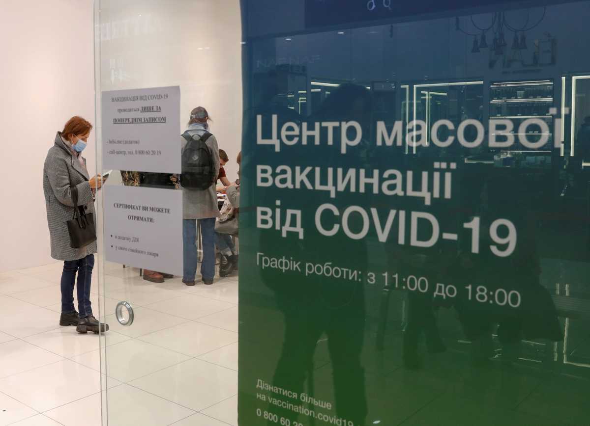 People wait to receive an injection of vaccine against the coronavirus disease (COVID-19) at a vaccination centre in a shopping mall in Kyiv, Ukraine October 27, 2021. Picture taken October 27, 2021. REUTERS
