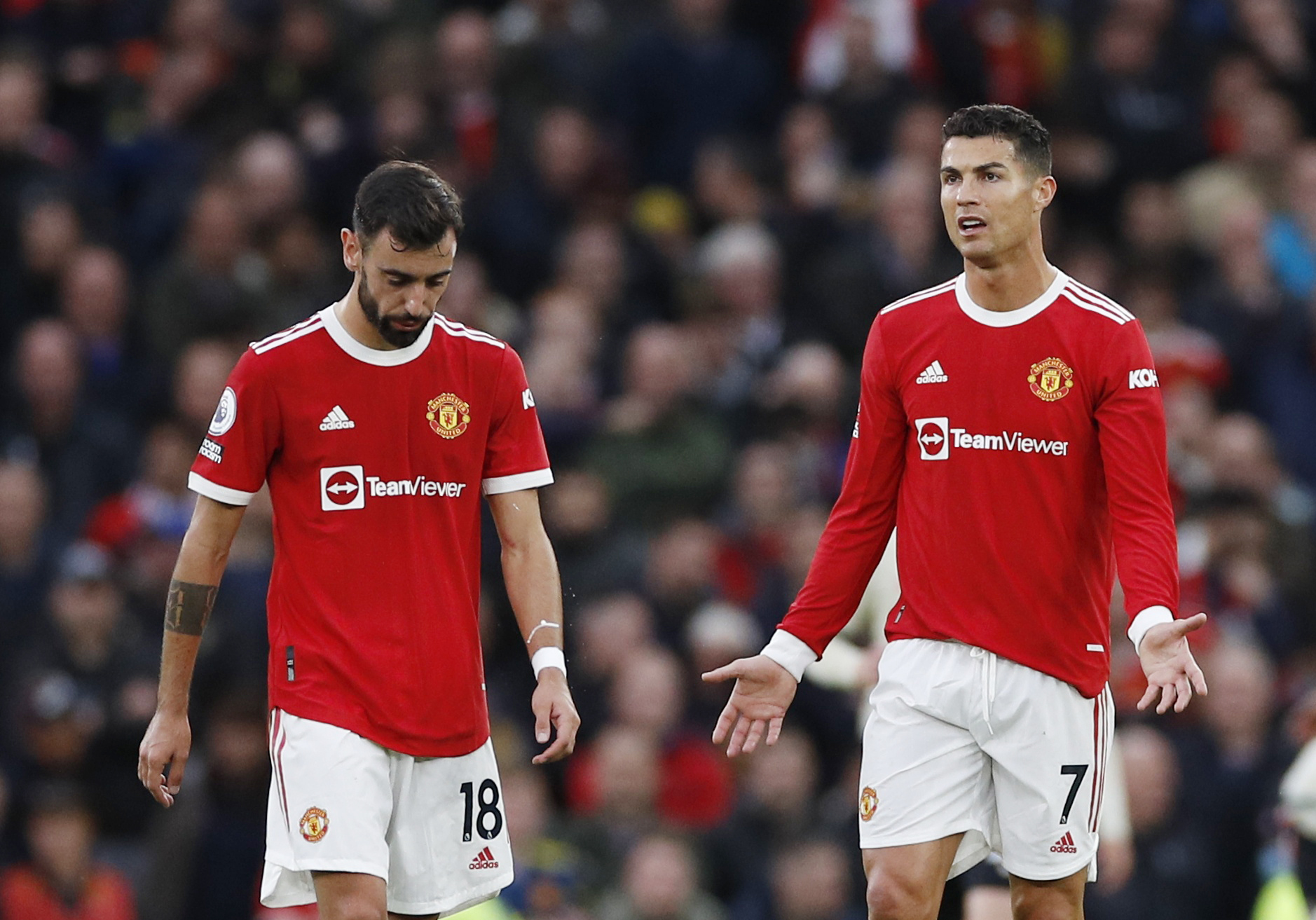 Soccer Football - Premier League - Manchester United v Liverpool - Old Trafford, Manchester, Britain - October 24, 2021 Manchester United's Bruno Fernandes and Cristiano Ronaldo look dejected after Liverpool's Mohamed Salah scores their third goal REUTERS