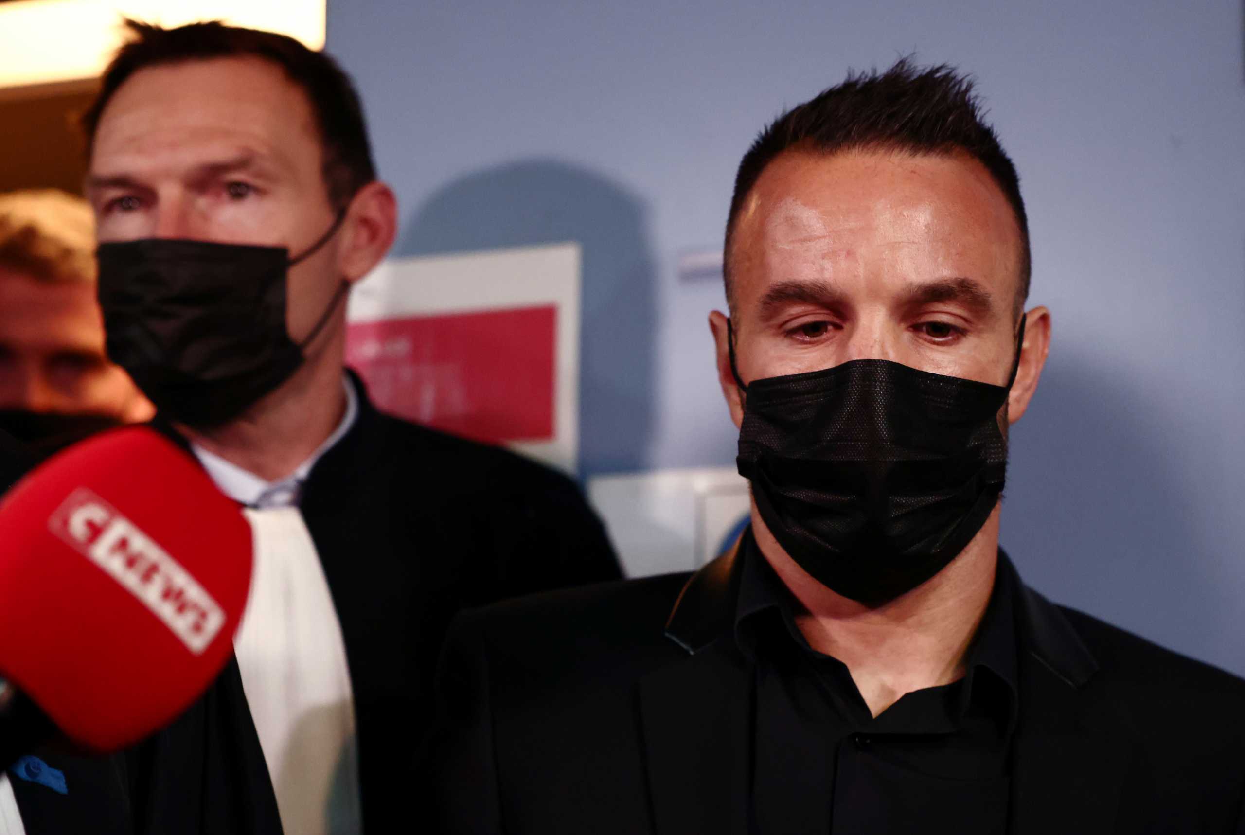 French soccer player Mathieu Valbuena and his lawyer Didier Domat answer questions to journalists during a break in the trial of Real Madrid soccer team player Karim Benzema and other defendants, on charges of involvement in an alleged attempt to blackmail Valbuena over a sex tape almost five years ago, at the Versailles courthouse, near Paris, France, October 20, 2021. REUTERS
