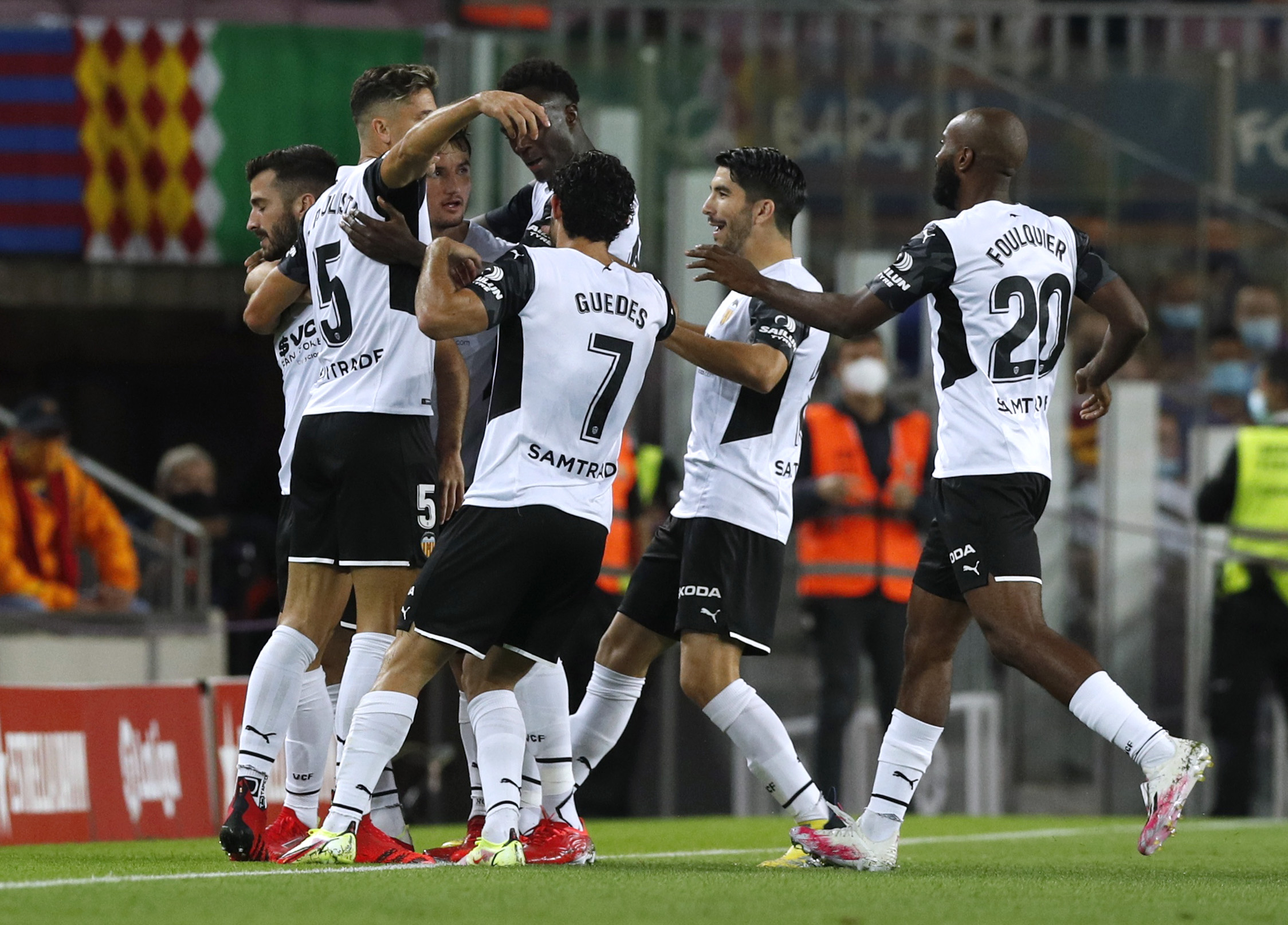 Soccer Football - LaLiga - FC Barcelona v Valencia - Camp Nou, Barcelona, Spain - October 17, 2021 Valencia's Jose Gaya celebrates scoring their first goal with teammates REUTERS