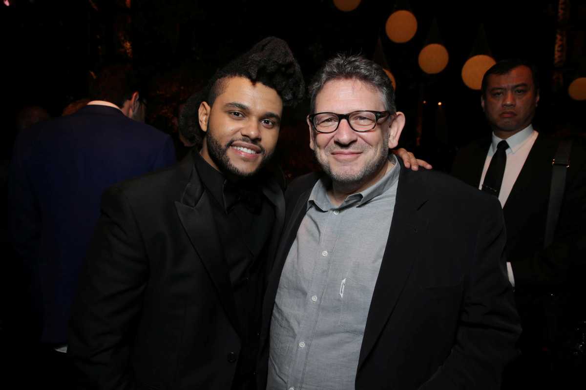 Lucian Grainge, Chairman and CEO of Universal Music Group, poses for a photo with singer The Weeknd in this undated handout photo.  Courtesy of Universal Music Group