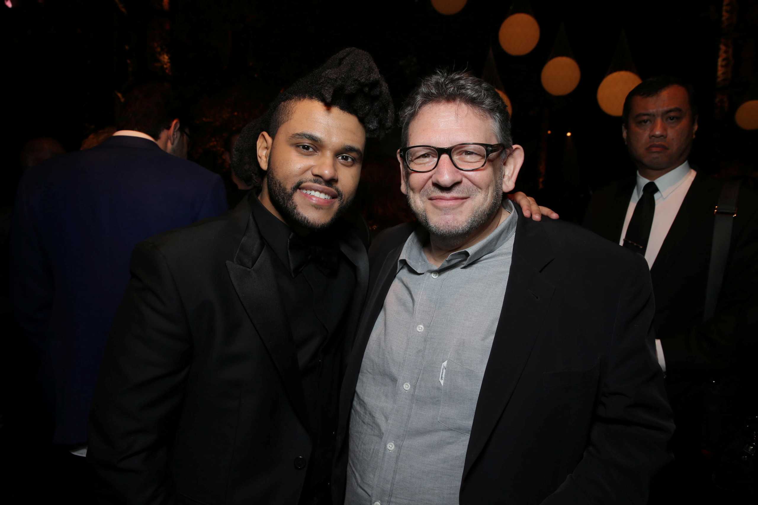 Lucian Grainge, Chairman and CEO of Universal Music Group, poses for a photo with singer The Weeknd in this undated handout photo.  Courtesy of Universal Music Group