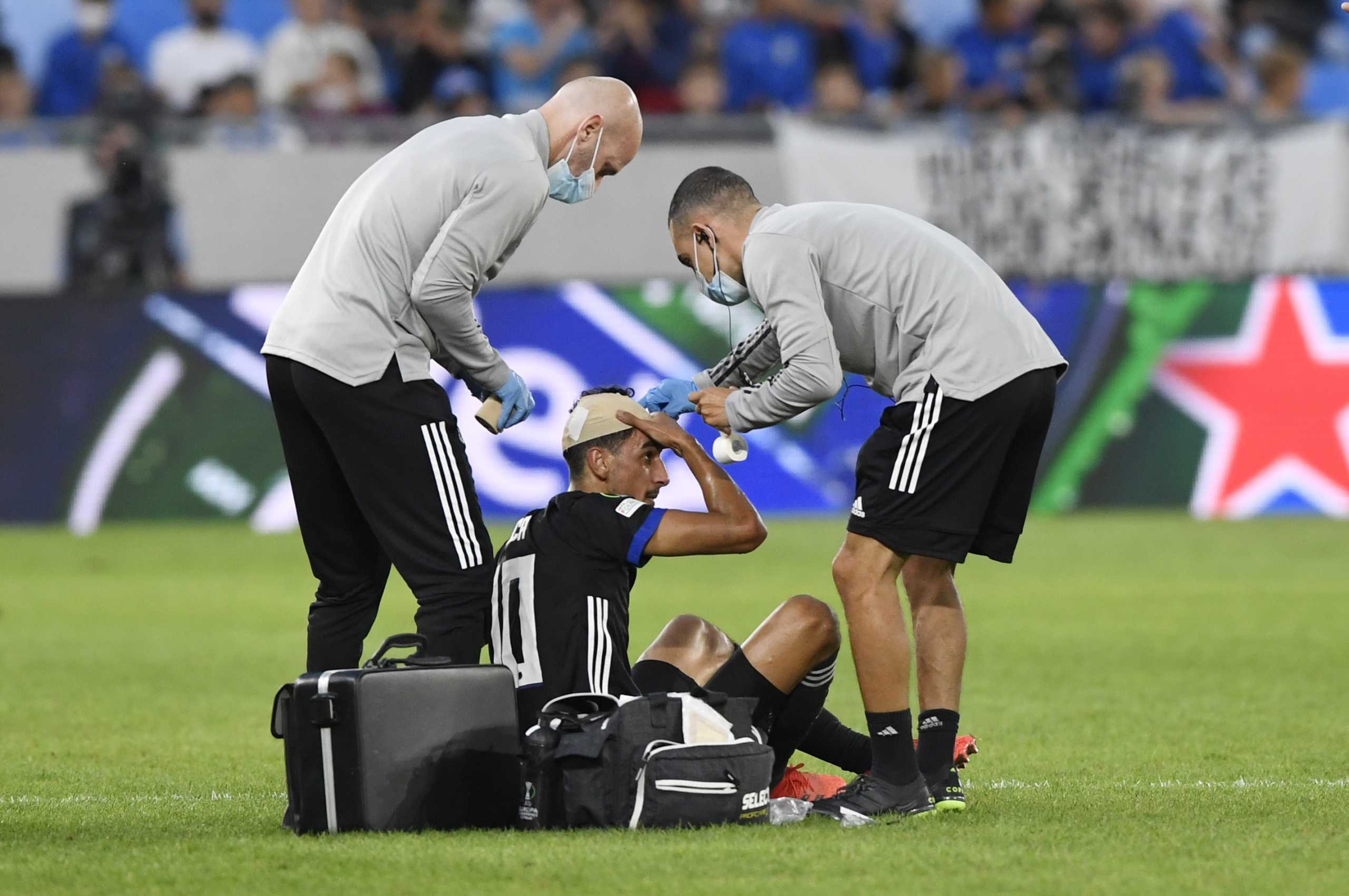Soccer Football - Europa Conference League - Group F - Slovan Bratislava v FC Copenhagen - Tehelne pole, Bratislava, Slovakia - September 16, 2021 FC Copenhagen's Zeca receives medical attention after sustaining an injury REUTERS