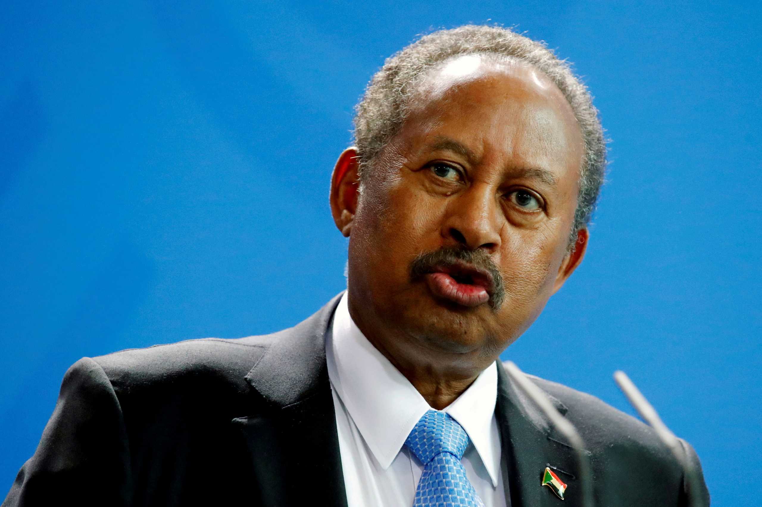 FILE PHOTO: Sudan's Prime Minister Abdalla Hamdok and German Chancellor Angela Merkel (not pictured) address the media at the Chancellery in Berlin, Germany, February 14, 2020. REUTERS