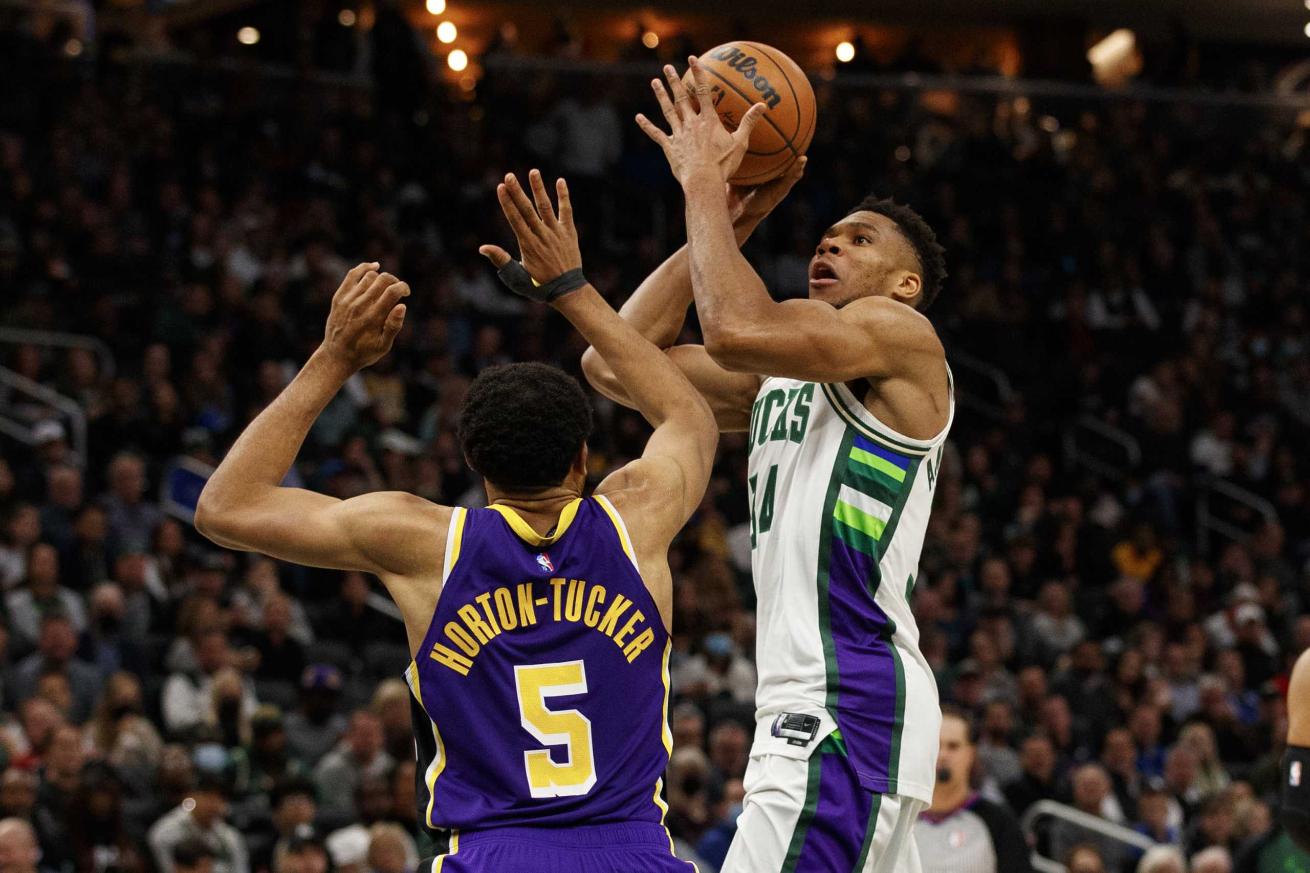 Nov 17, 2021; Milwaukee, Wisconsin, USA;  Milwaukee Bucks forward Giannis Antetokounmpo (34) shoots over Los Angeles Lakers guard Talen Horton-Tucker (5) during the fourth quarter at Fiserv Forum. Mandatory Credit: Jeff Hanisch-USA TODAY Sports