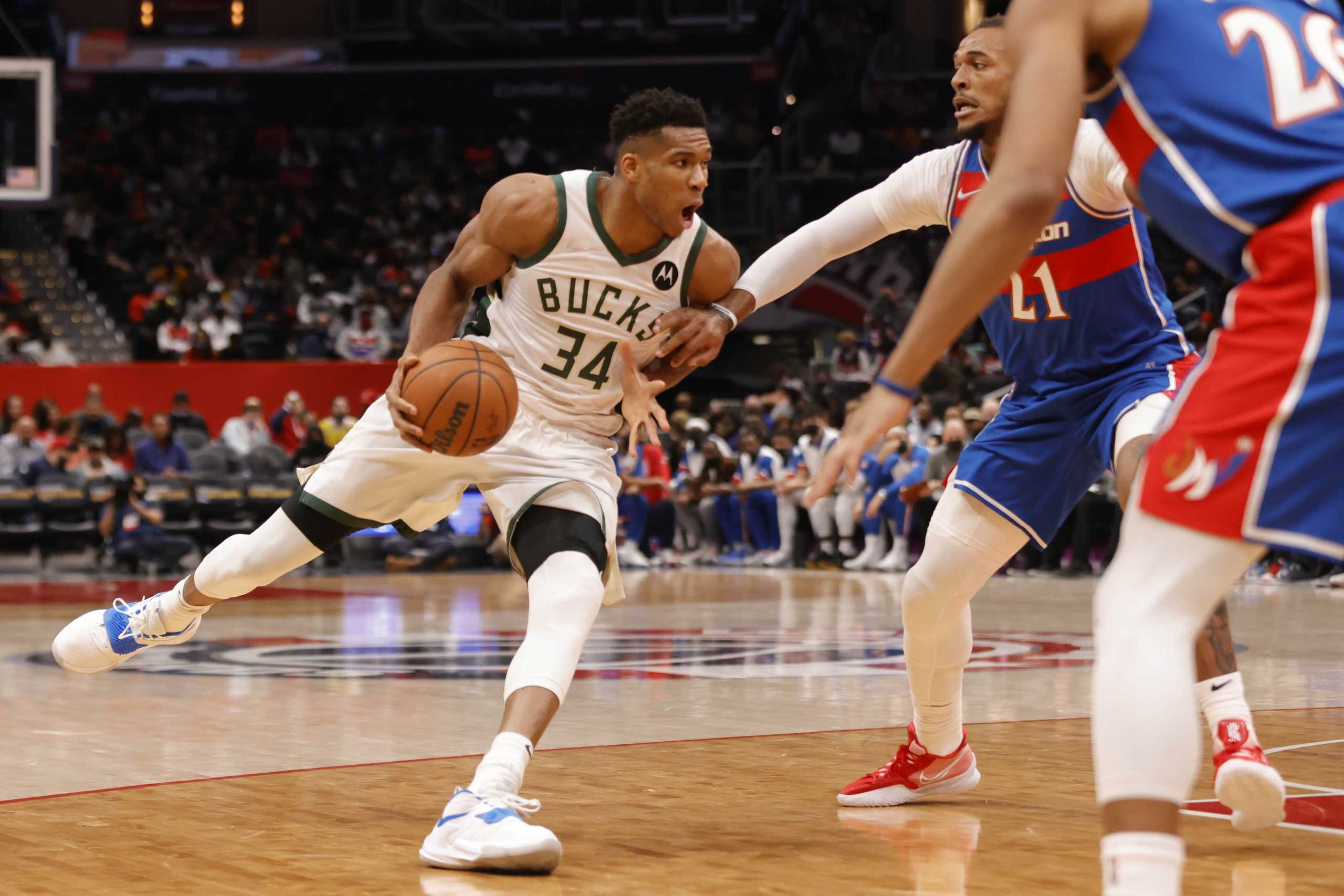 Nov 7, 2021; Washington, District of Columbia, USA; Milwaukee Bucks forward Giannis Antetokounmpo (34) drives to the basket as Washington Wizards center Daniel Gafford (21) defends during the second quarter at Capital One Arena. Mandatory Credit: Geoff Burke-USA TODAY Sports