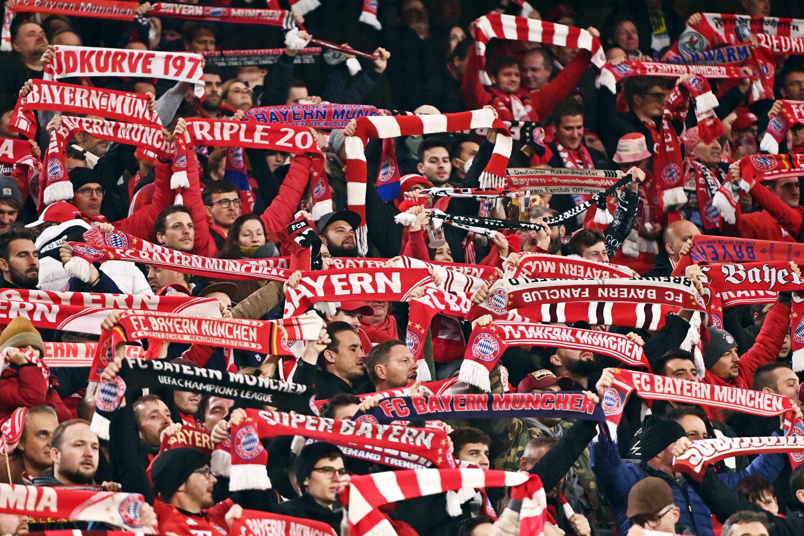 Soccer Football - Bundesliga - Bayern Munich v SC Freiburg - Allianz Arena, Munich, Germany - November 6, 2021 Bayern Munich fans waving scarves inside the stadium during the match REUTERS
