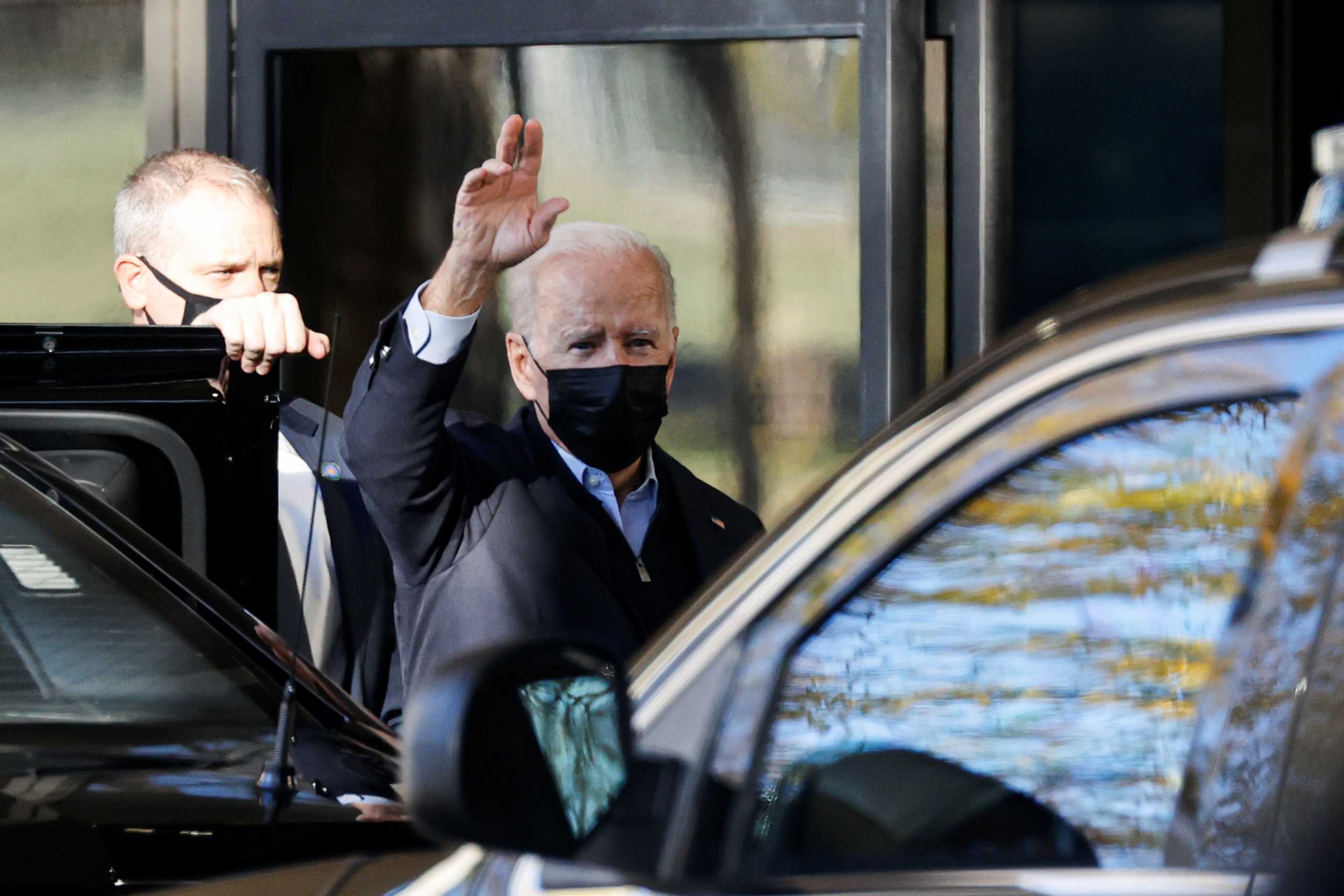U.S. President Joe Biden waves to reporters as he arrives for his annual physical at Walter Reed National Military Medical Center in Bethesda, Maryland, U.S., U.S. November 19, 2021. REUTERS