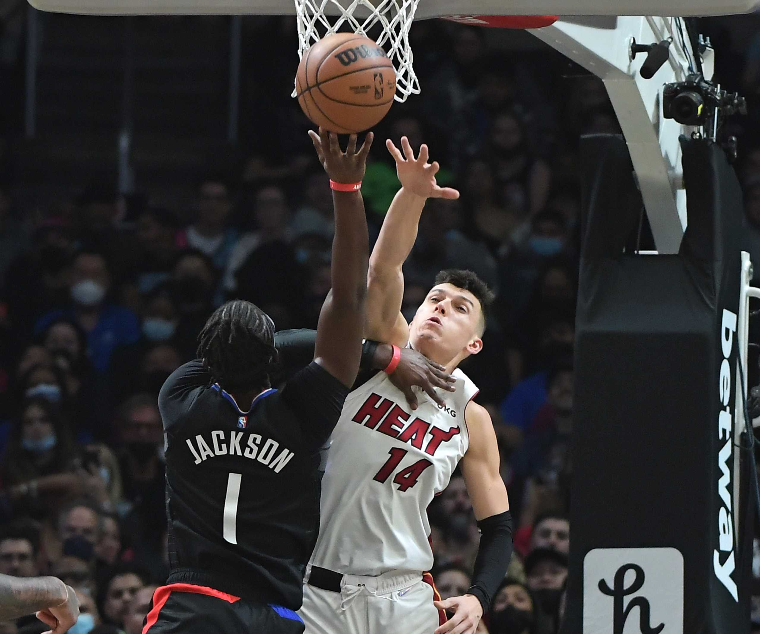 Nov 11, 2021; Los Angeles, California, USA;   Miami Heat guard Tyler Herro (14) defends a shot by Los Angeles Clippers guard Reggie Jackson (1) in the second half at Staples Center. Mandatory Credit: Jayne Kamin-Oncea-USA TODAY Sports