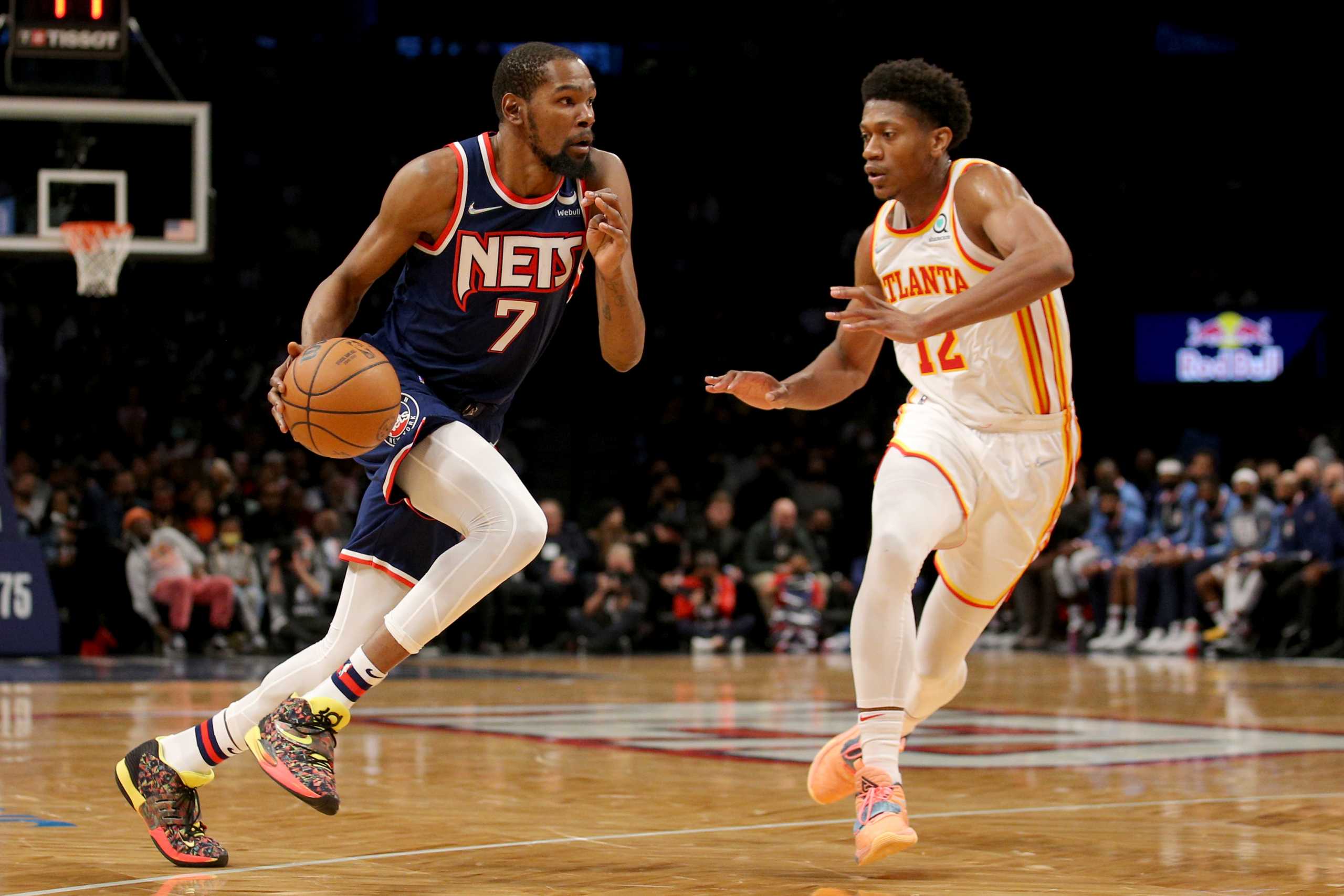 Nov 3, 2021; Brooklyn, New York, USA; Brooklyn Nets forward Kevin Durant (7) drives to the basket against Atlanta Hawks forward De'Andre Hunter (12) during the third quarter at Barclays Center. Mandatory Credit: Brad Penner-USA TODAY Sports