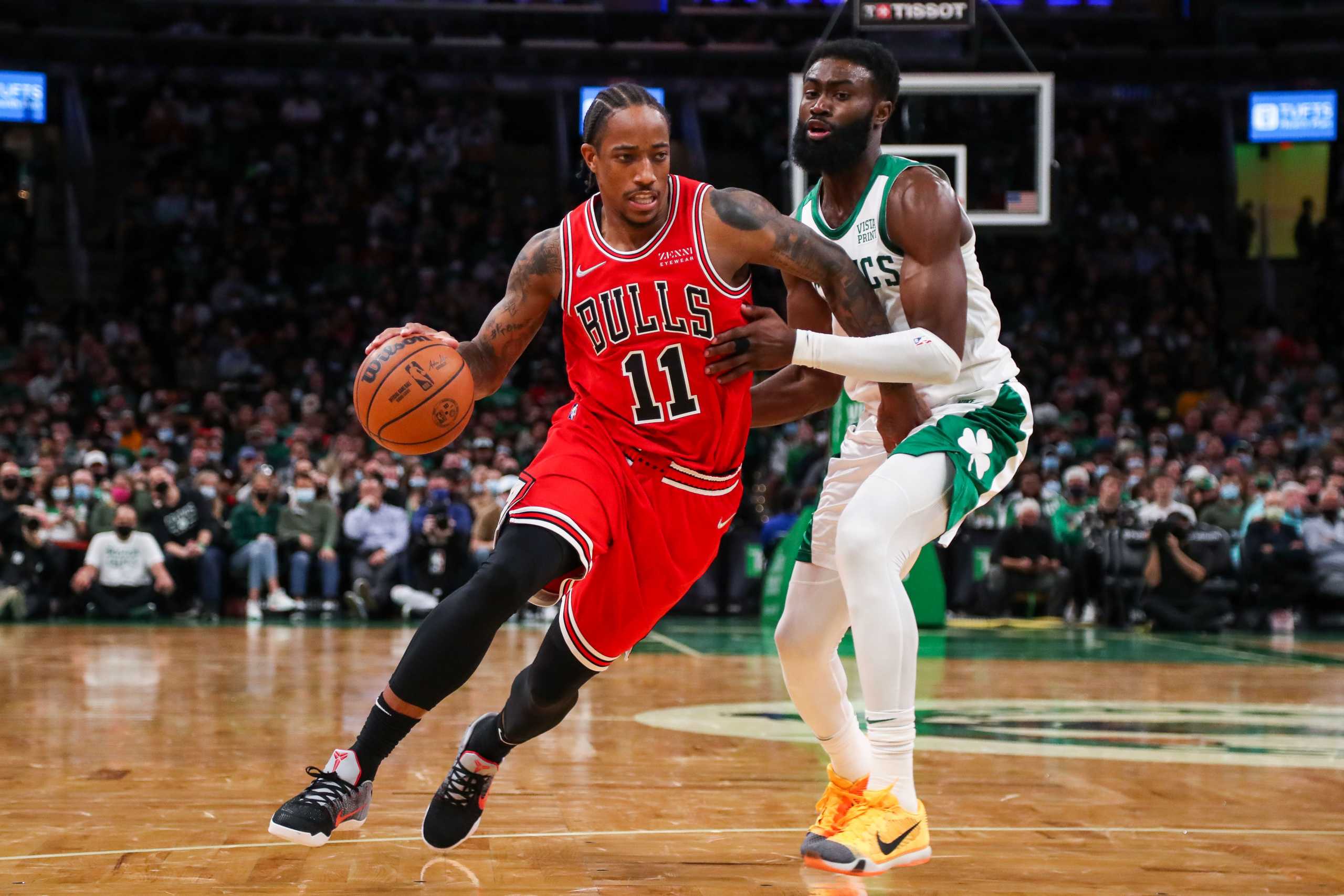 Nov 1, 2021; Boston, Massachusetts, USA; Chicago Bulls forward DeMar DeRozan (11) drives to the basket defended by Boston Celtics forward Jaylen Brown (7) during the second half at TD Garden. Mandatory Credit: Paul Rutherford-USA TODAY Sports