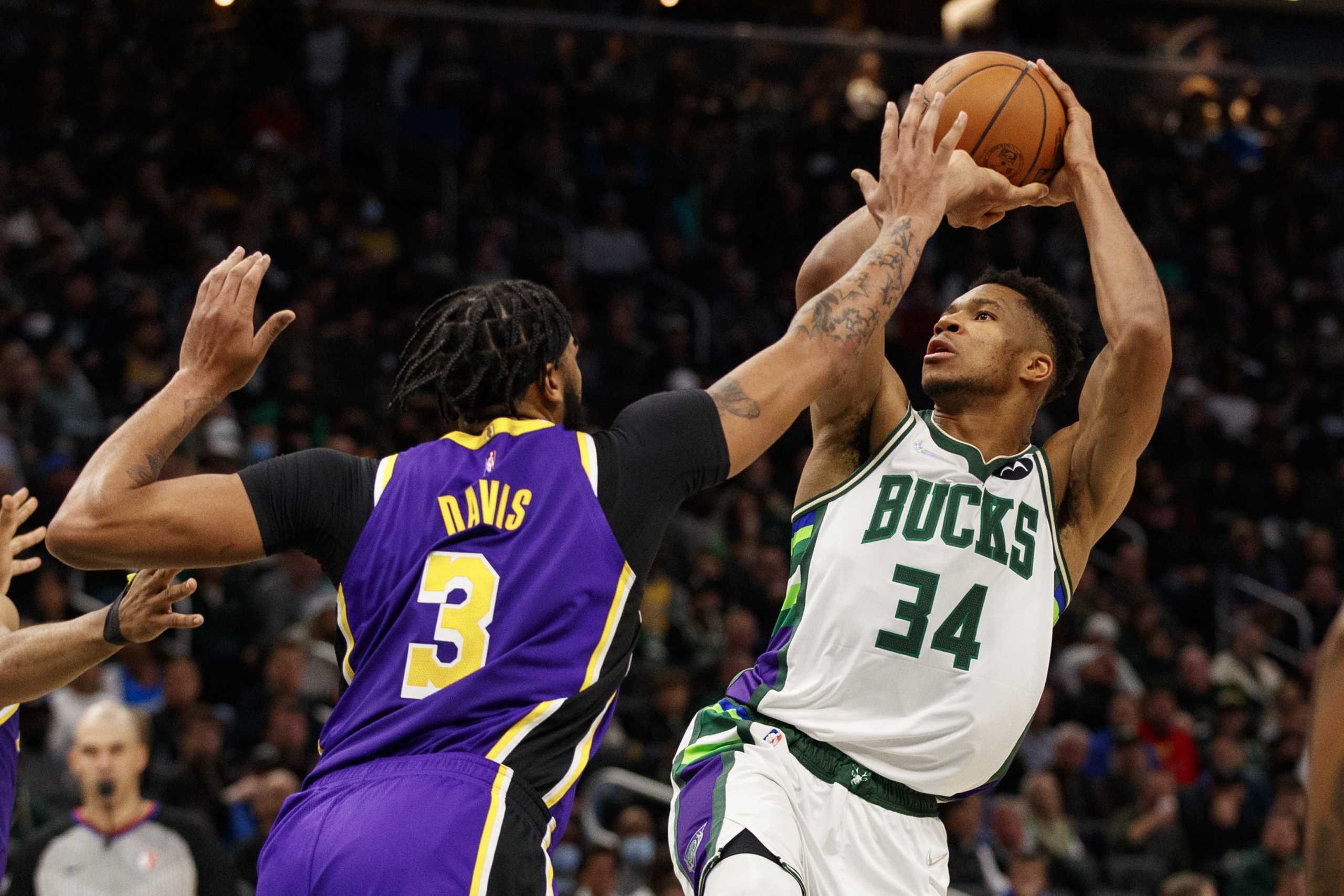 Nov 17, 2021; Milwaukee, Wisconsin, USA;  Milwaukee Bucks forward Giannis Antetokounmpo (34) shoots against Los Angeles Lakers forward Anthony Davis (3) during the third quarter at Fiserv Forum. Mandatory Credit: Jeff Hanisch-USA TODAY Sports