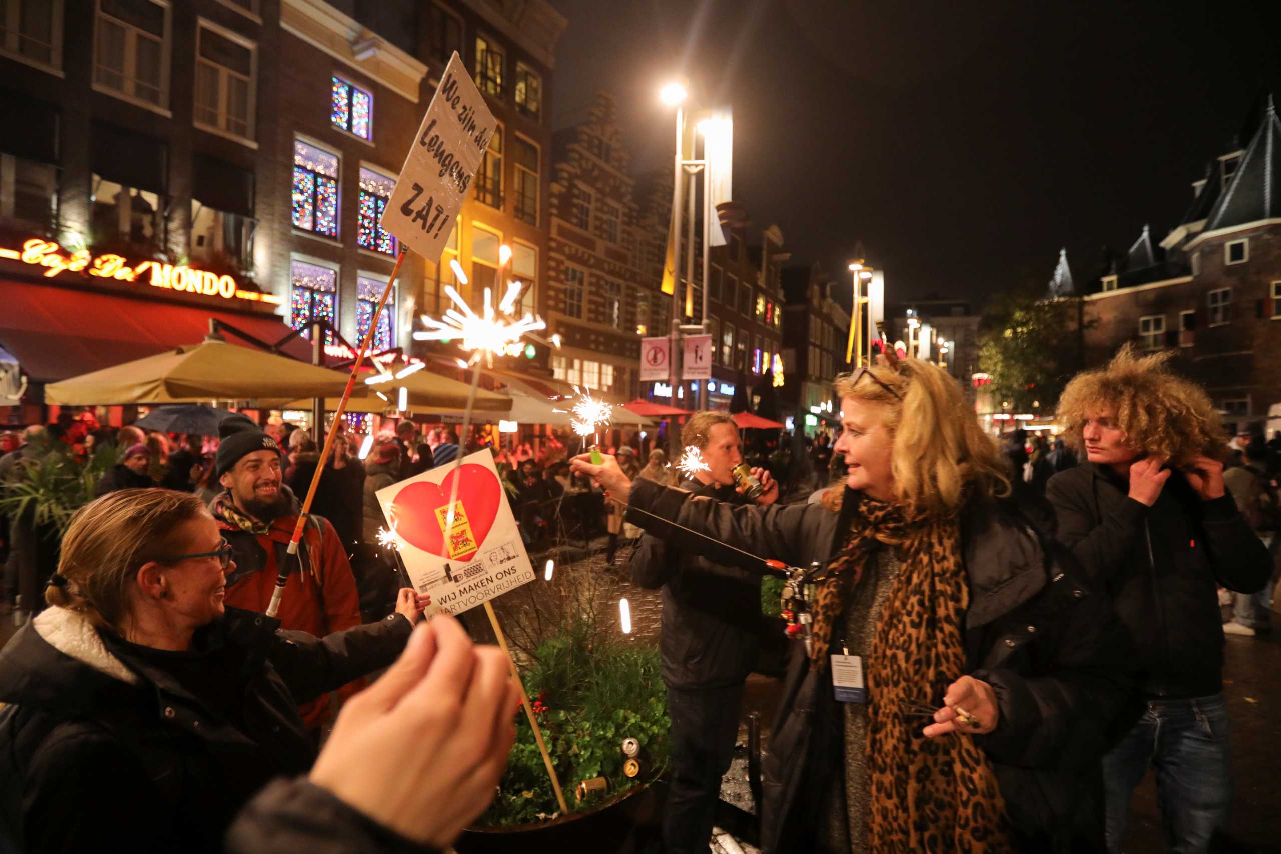 Protestors gather at Cafe del Mondo during demonstrations against coronavirus disease (COVID-19) measures in Amsterdam, Netherlands, November 20, 2021. REUTERS