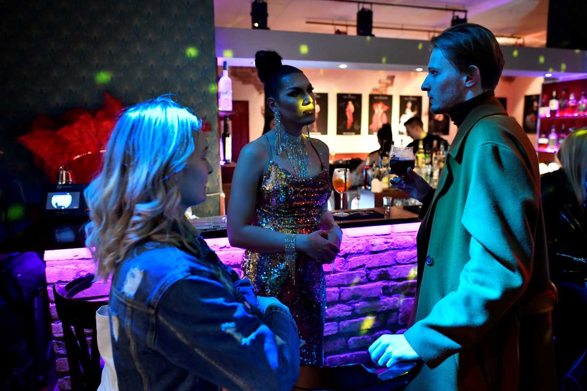 FILE PHOTO: Transgender woman Daniella Milla Tokodi talks with guests during the reopening of a LGBTQ bar in Budapest, Hungary, November 5, 2021. Picture taken November 5, 2021. REUTERS