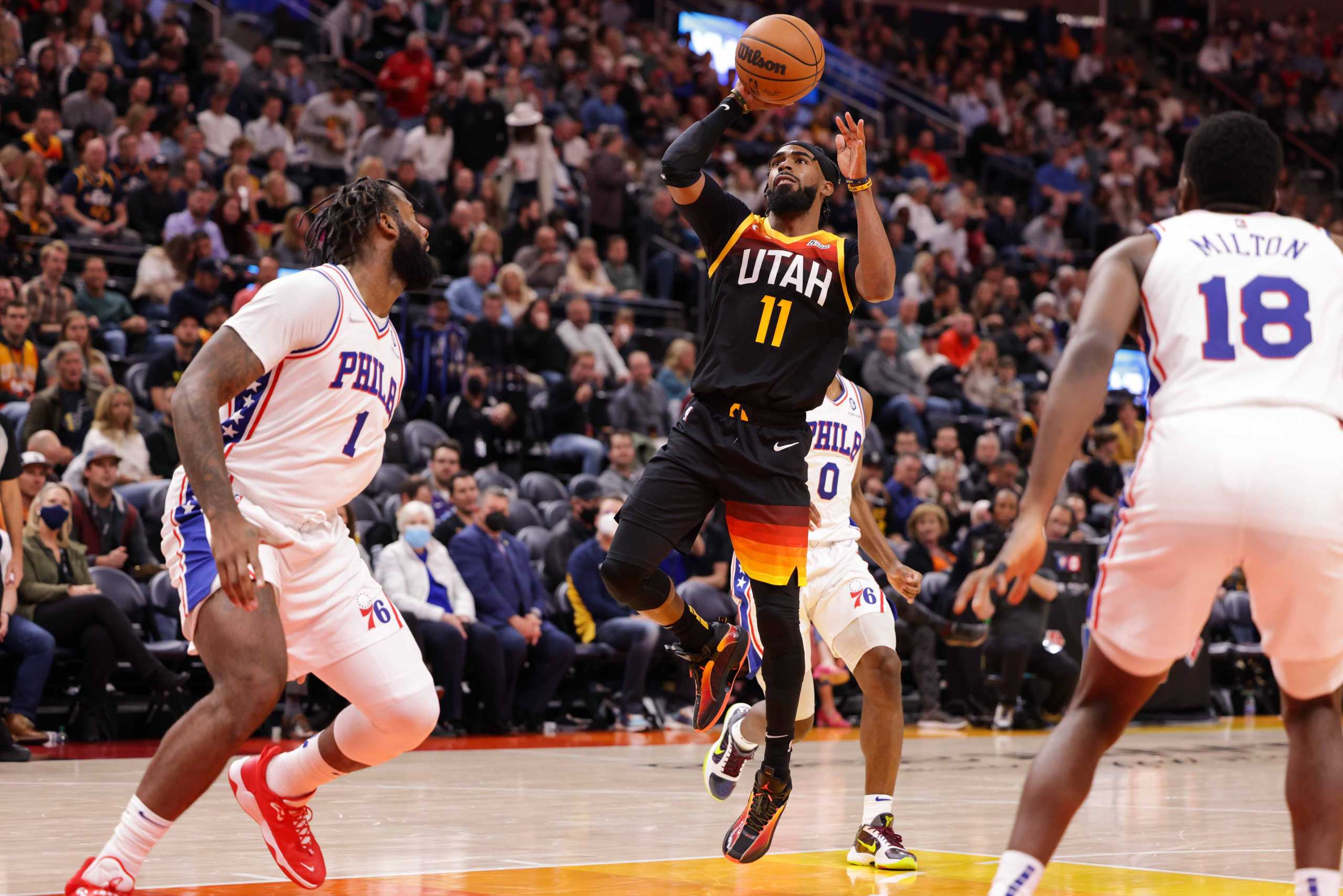 Nov 16, 2021; Salt Lake City, Utah, USA; Utah Jazz guard Mike Conley (11) pushes the ball up to the basket against the Philadelphia 76ers during the third quarter at Vivint Arena. Utah Jazz won 120-85. Mandatory Credit: Chris Nicoll-USA TODAY Sports