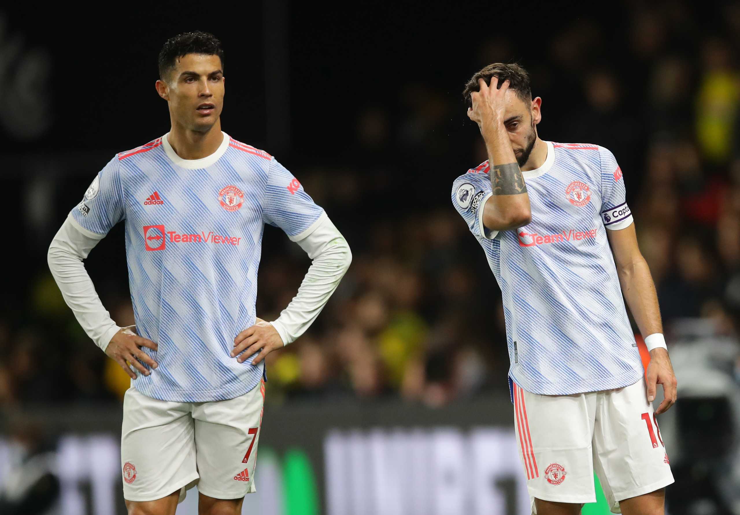 Soccer Football - Premier League - Watford v Manchester United - Vicarage Road, Watford, Britain - November 20, 2021 Manchester United's Cristiano Ronaldo and Bruno Fernandes react REUTERS