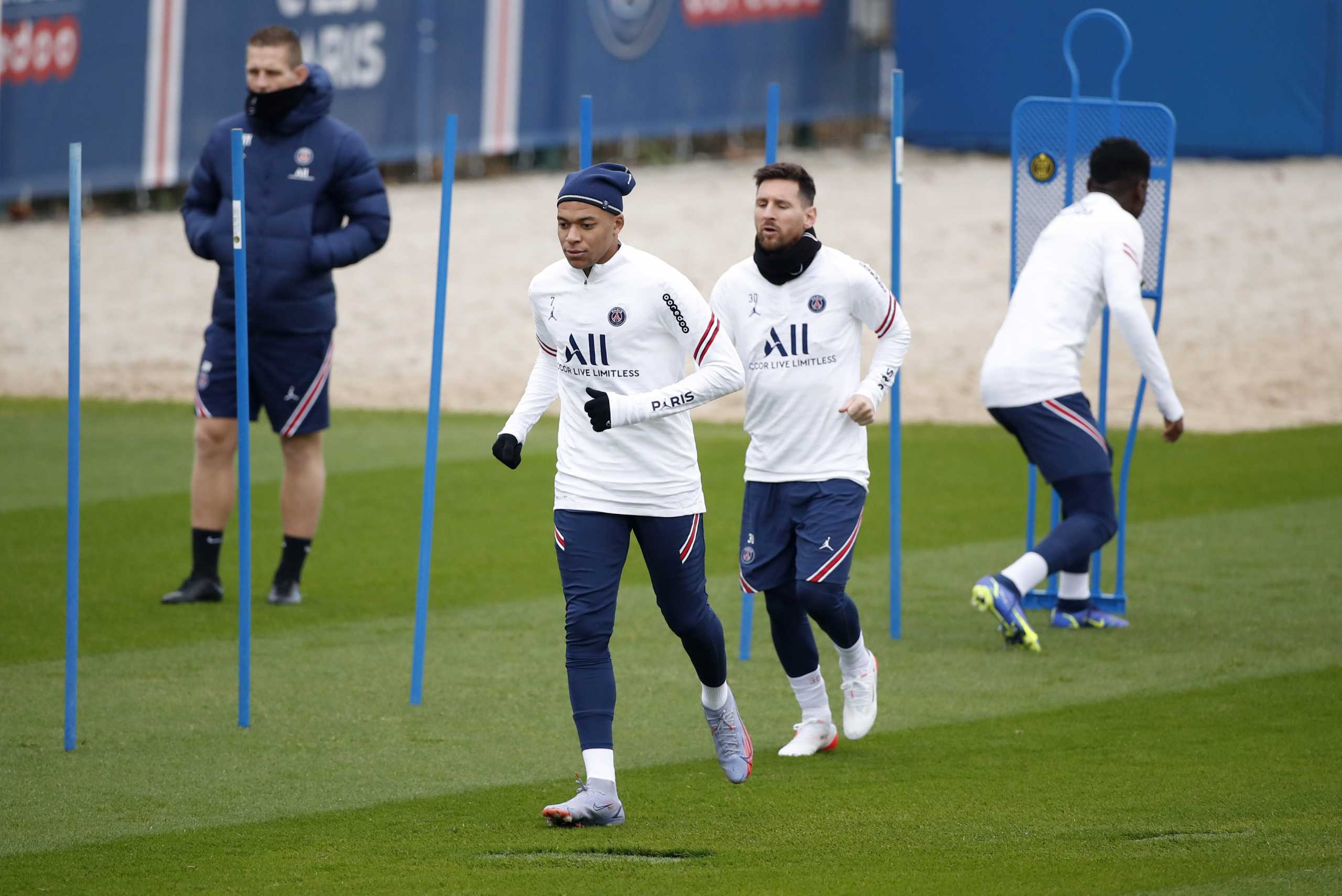 Soccer Football - Ligue 1 - Paris St Germain Training - Ooredoo Training Centre, Saint-Germain-en-Laye, France - November 19, 2021  Paris St Germain's Kylian Mbappe and Lionel Messi during training REUTERS