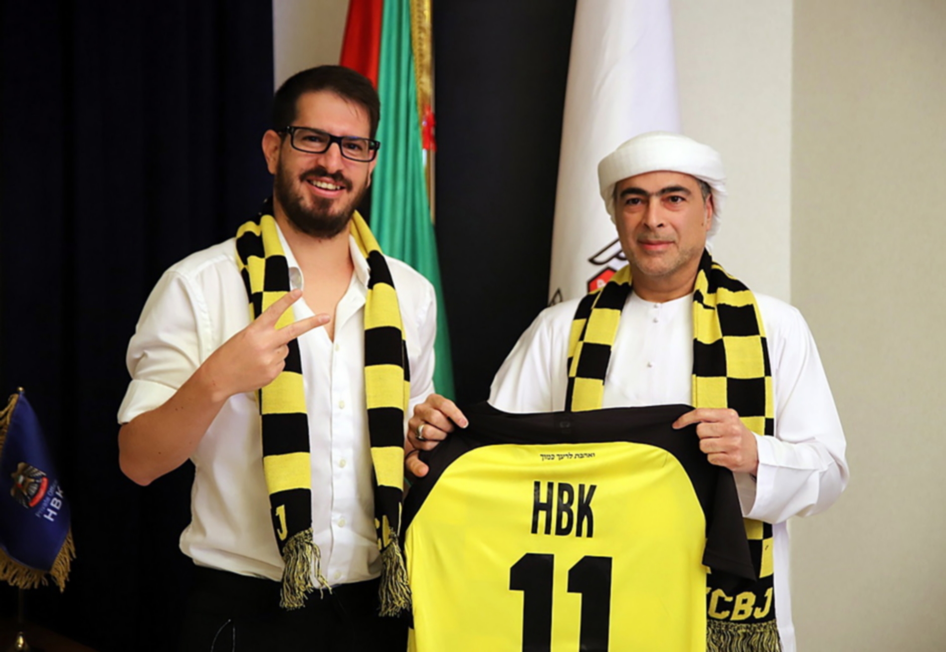 epa08870328 A handout photo made available by Beitar Jerusalem Club shows Moshe Hogeg (L), soccer club owner of Beitar Jerusalem, and Sheikh Hamad bin Khalifa Al Nahyan (R) during the signing of a partnership agreement between the Beitar Jerusalem soccer club and Sheikh Hamad bin Khalifa Al Nahyan, in Dubai, 08 December 2020. Sheikh Hamad bin Khalifa Al Nahyan, a member of Abu Dhabi ruling family, has bought 50 percent of the Beitar Jerusalem soccer club and will invest 300 million Israeli Shekel (92 million US dollars) in the team over the next decade.  EPA