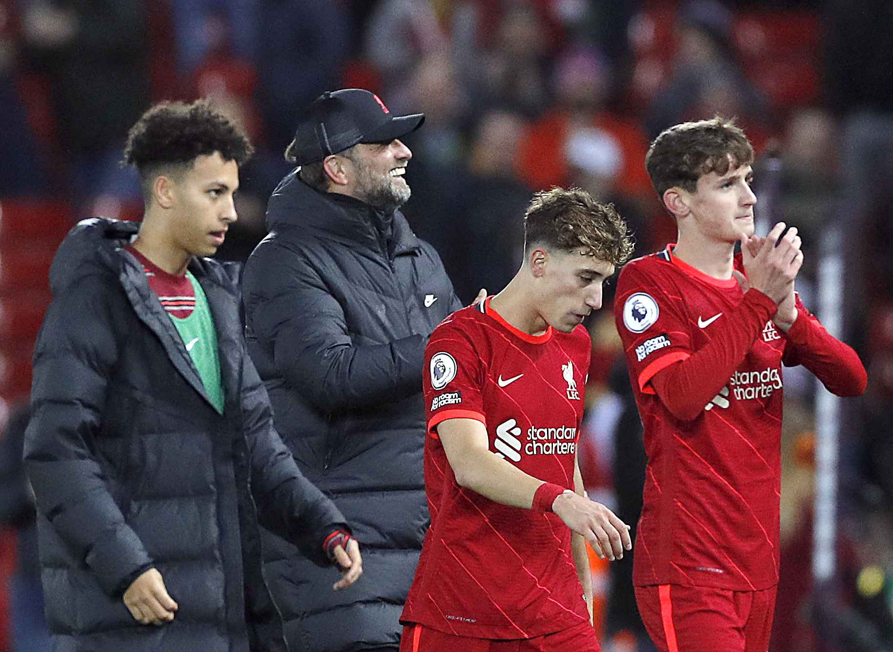 Soccer Football - Premier League - Liverpool v Arsenal - Anfield, Liverpool, Britain - November 20, 2021 Liverpool manager Juergen Klopp, Kostas Tsimikas and Tyler Morton celebrate after the match Action Images via Reuters