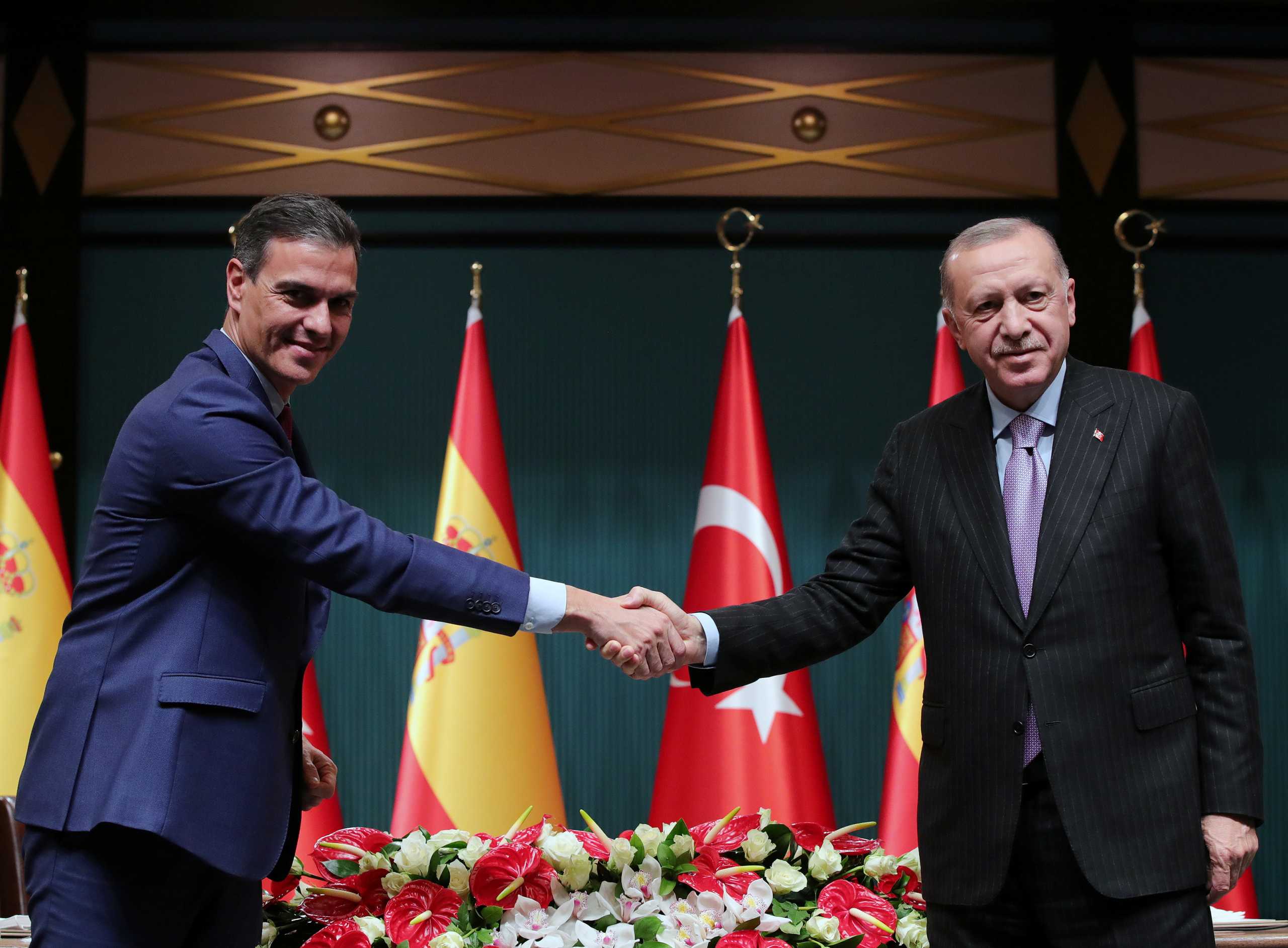 Turkey's President Tayyip Erdogan and Spain's Prime Minister Pedro Sanchez shake hands during a news conference in Ankara, Turkey November 17, 2021. Presidential Press Office