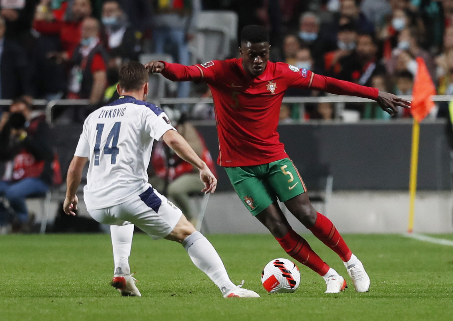 Soccer Football - World Cup - UEFA Qualifiers - Group A - Portugal v Serbia - Estadio da Luz, Lisbon, Portugal - November 14, 2021 Portugal's Nuno Mendes in action with Serbia's Andrija Zivkovic REUTERS