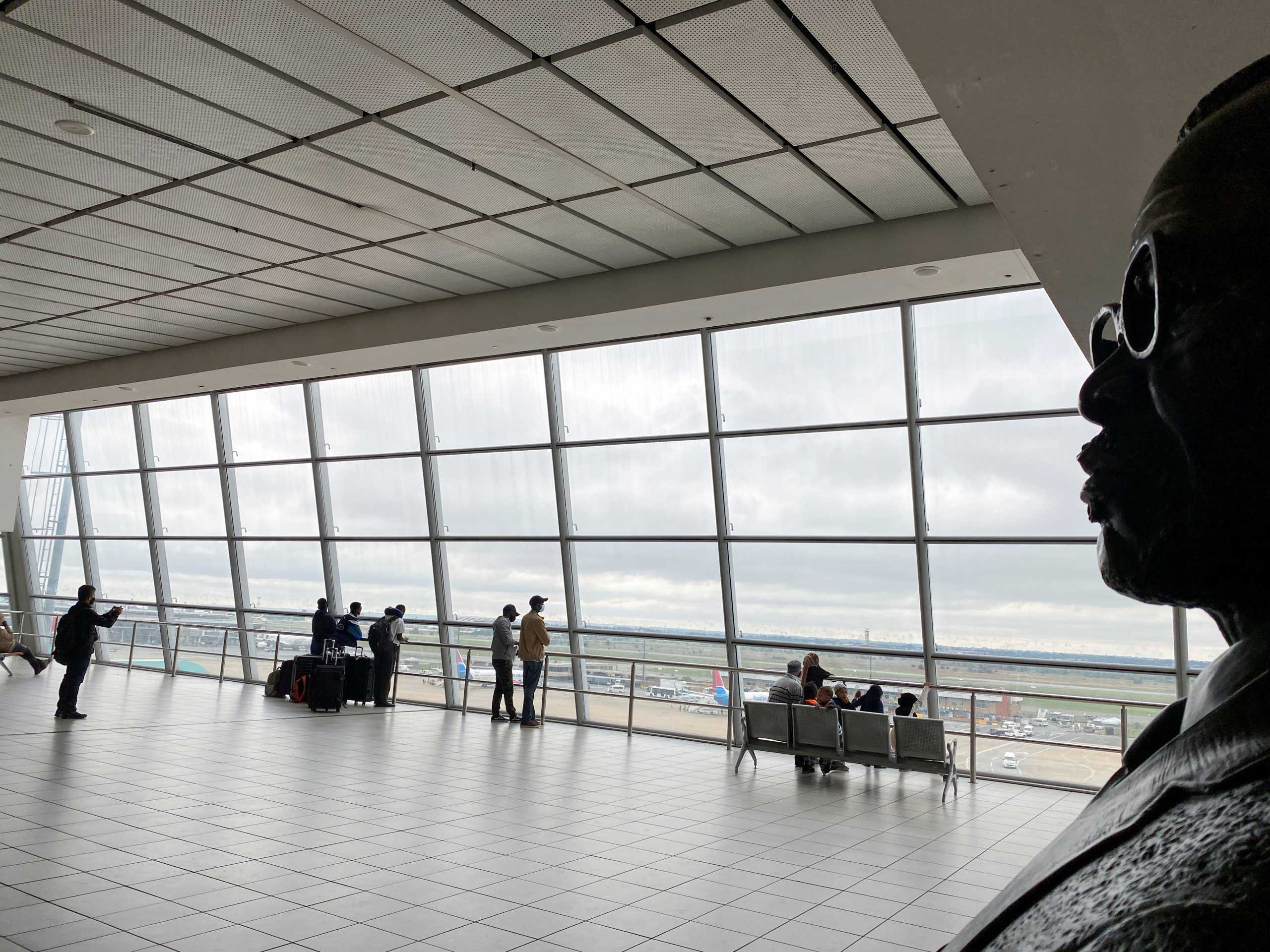 Passengers wait to board flights, amidst the spread of the new SARS-CoV-2 variant, at O.R. Tambo International Airport in Johannesburg, South Africa, November 27, 2021. REUTERS